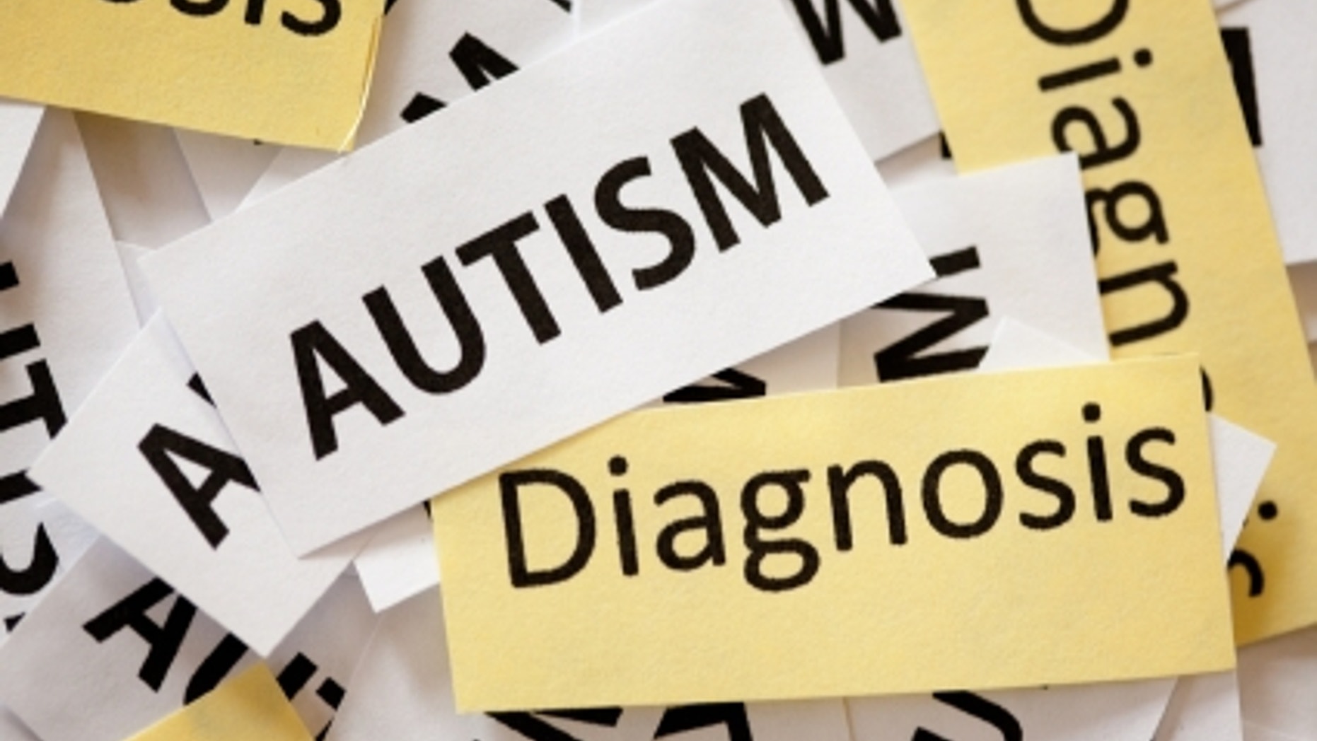 Snippets of paper reading "Autism Diagnosis" on them.