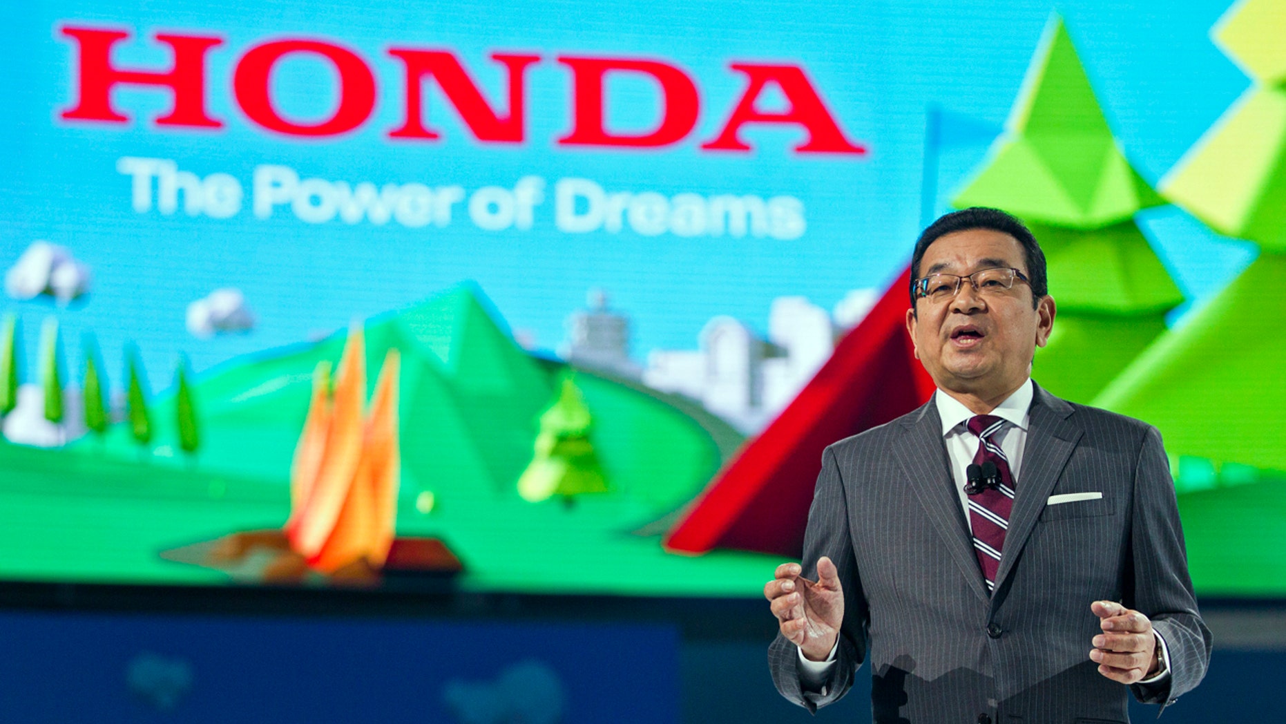 Takahiro Hachigo, President and CEO of Honda, speaks at the North American International Auto Show, Monday, Jan. 9, 2017, in Detroit.