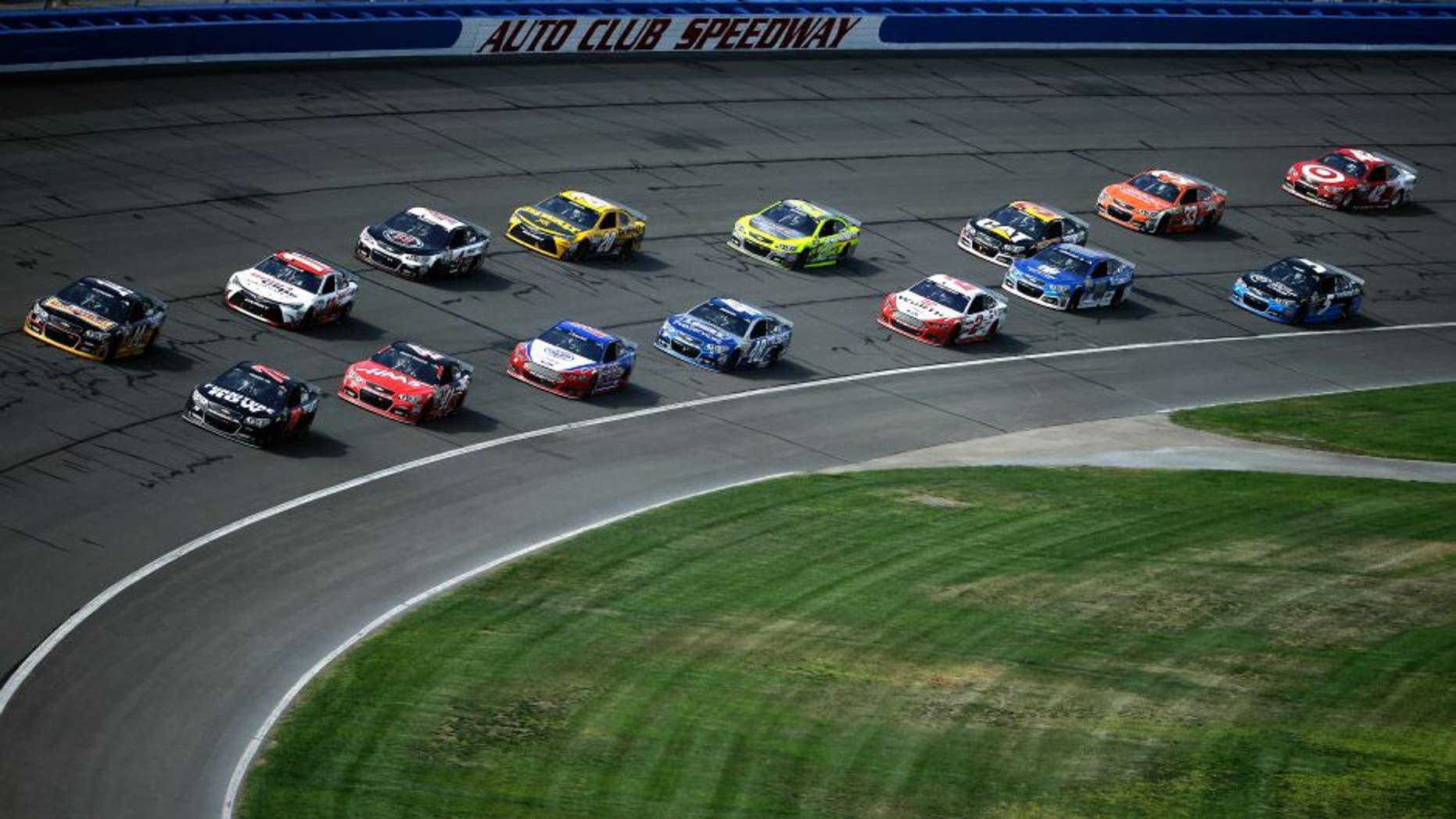 FONTANA, CA - MARCH 22: General view as Tony Stewart, driver of the #14 Rush Truck Centers/ Mobil 1 Chevrolet, and Martin Truex Jr., driver of the #78 Furniture Row / Visser Precision Chevrolet, lead a pack of cars during the NASCAR Sprint Cup Series Auto Club 400 at Auto Club Speedway on March 22, 2015 in Fontana, California. (Photo by Jeff Gross/Getty Images)