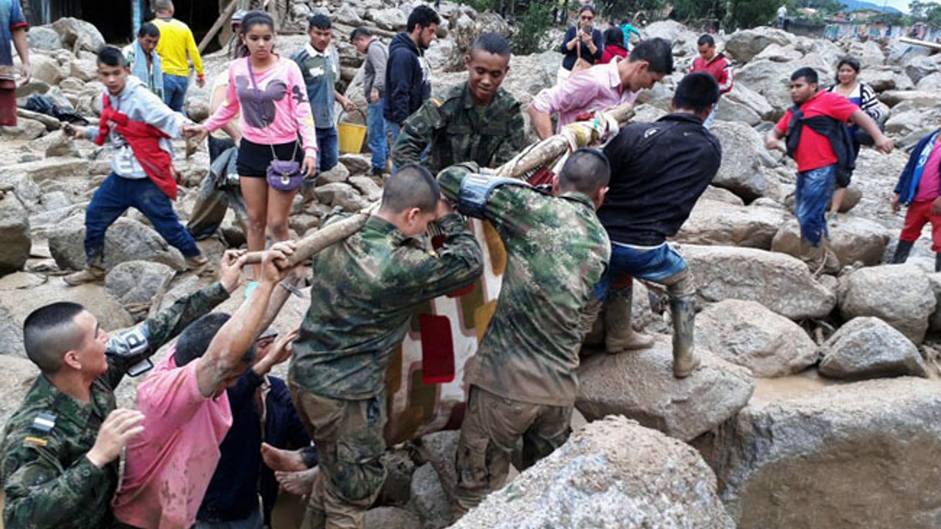 Soldiers and residents work together in rescue efforts in Mocoa, Colombia, on Saturday, April 1, 2017.