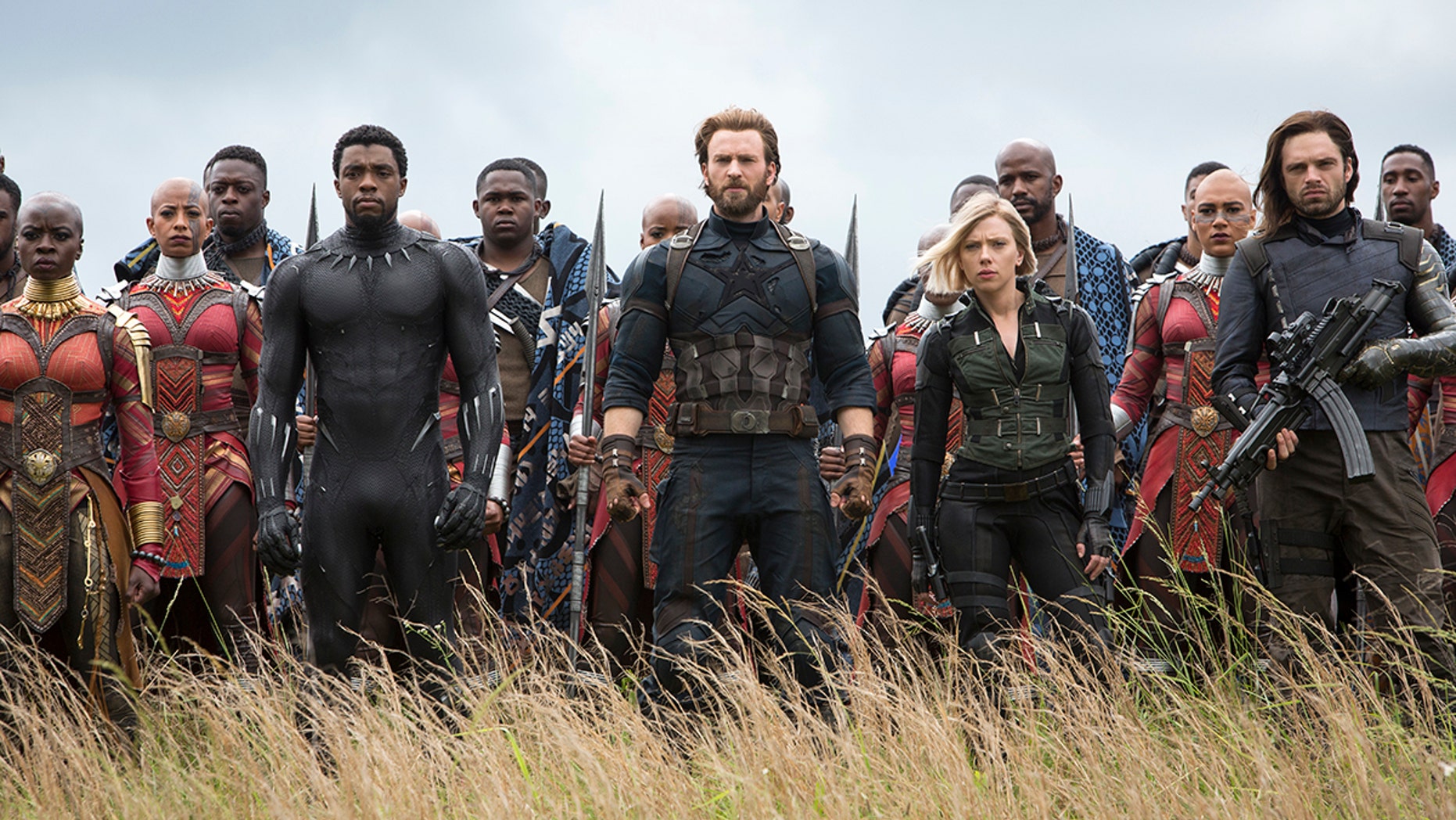 This image released by Marvel Studios shows, front row from left, Danai Gurira, Chadwick Boseman, Chris Evans, Scarlet Johansson and Sebastian Stan in a scene from "Avengers: Infinity War," premiering on April 27. (Chuck Zlotnick/Marvel Studios via AP)