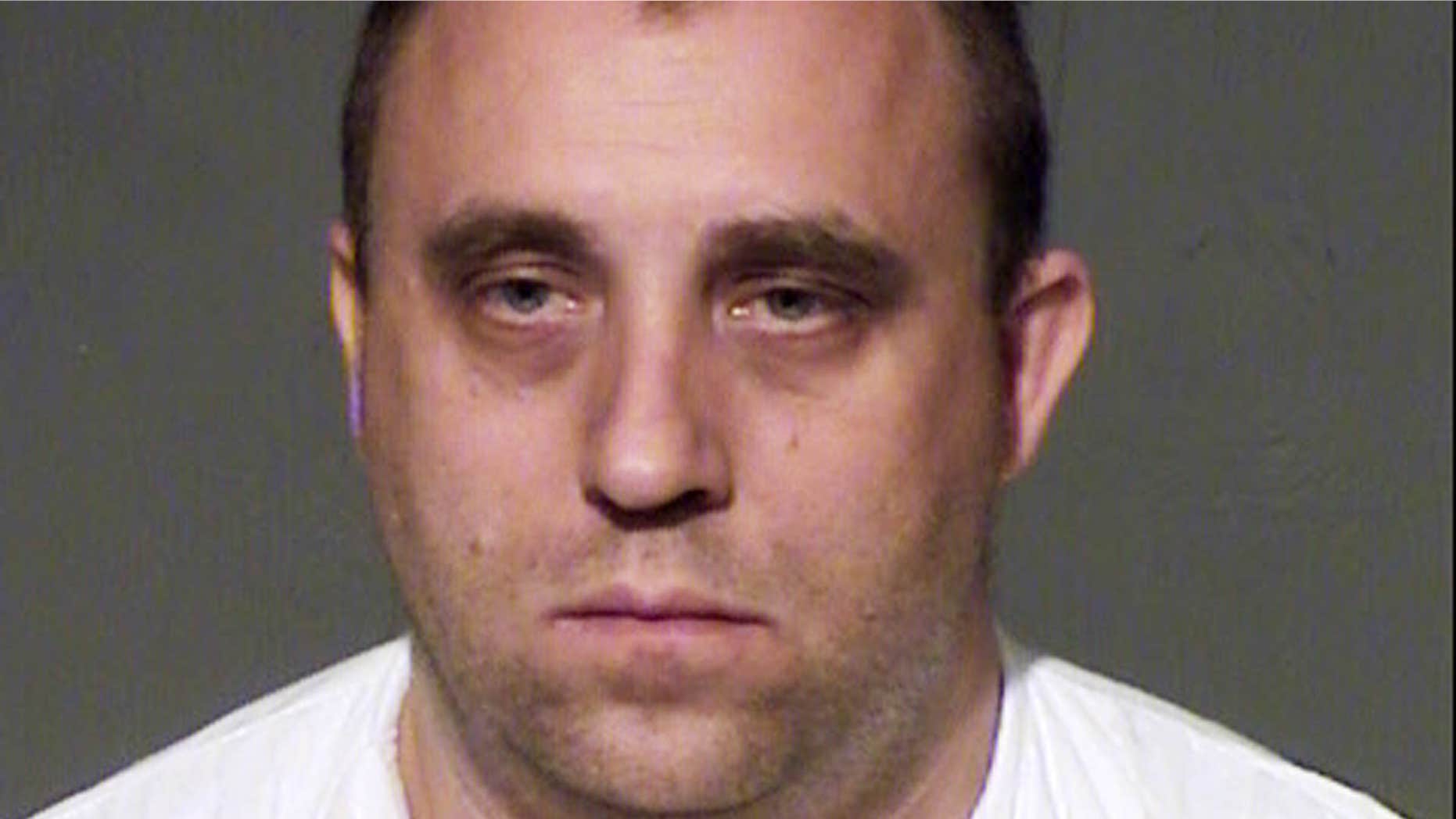 March 26, 2015: This law enforcement booking photo from the Maricopa County, Ariz., sheriff's office shows John Leo Davis.
