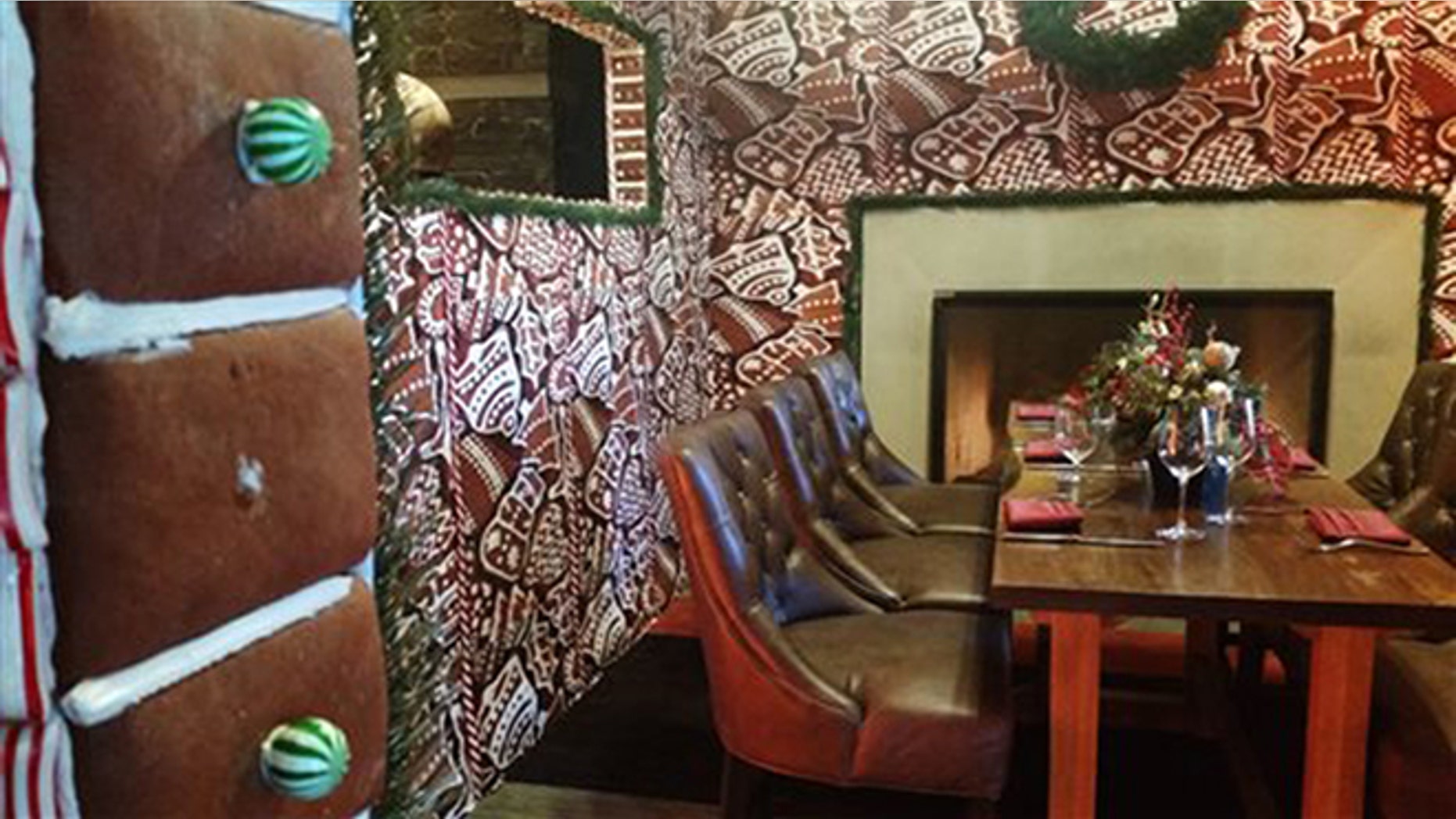 This Monday, Dec. 21, 2015 photo shows a giant gingerbread house at the Ritz Carlton, Dove Mountain in Marana, Ariz. The window frame, left, of the house is seen missing a piece of candy. (AP Photo/Terry Tang)
