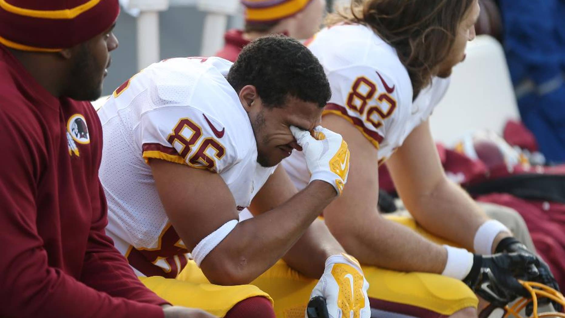 Washington Redskins tight end Jordan Reed reacts on the sidelines at the end of an NFL football game against the Minnesota Vikings, Sunday, Nov. 2, 2014, in Minneapolis. The Vikings won 29-26. (AP Photo/Jim Mone)