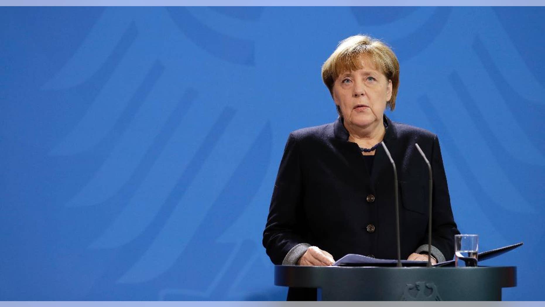 German Chancellor Angela Merkel speaks during a statement at the chancellery in Berlin, Germany, Tuesday, Dec. 20, 2016 the day after a truck ran into a crowded Christmas market and killed several people. (AP Photo/Michael Sohn)