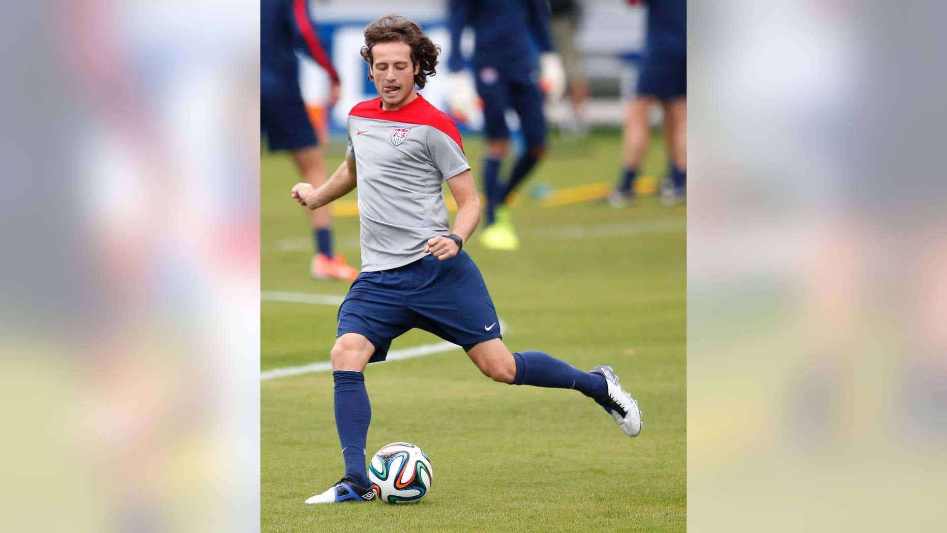 United States' Mix Diskerud kicks a ball during a training session in Sao Paulo, Brazil, Thursday, June 19, 2014. The United States will play against Portugal in group G of the 2014 soccer World Cup on June 22. (AP Photo/Julio Cortez)