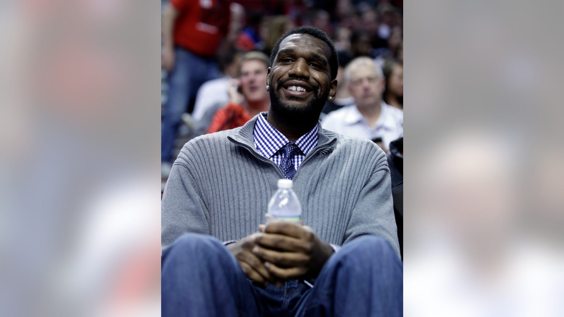 Former Portland Trail Blazers center Greg Oden watches from the crowd during the first quarter of an NBA basketball game between the Trail Blazers and Memphis Grizzlies in Portland, Ore., Wednesday, April 3, 2013.(AP Photo/Don Ryan)