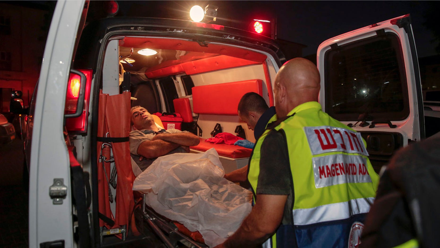 An injured man loaded into an ambulance after rocket fire from the Gaza Strip hit the town of Sderot, Israel, on Wednesday.