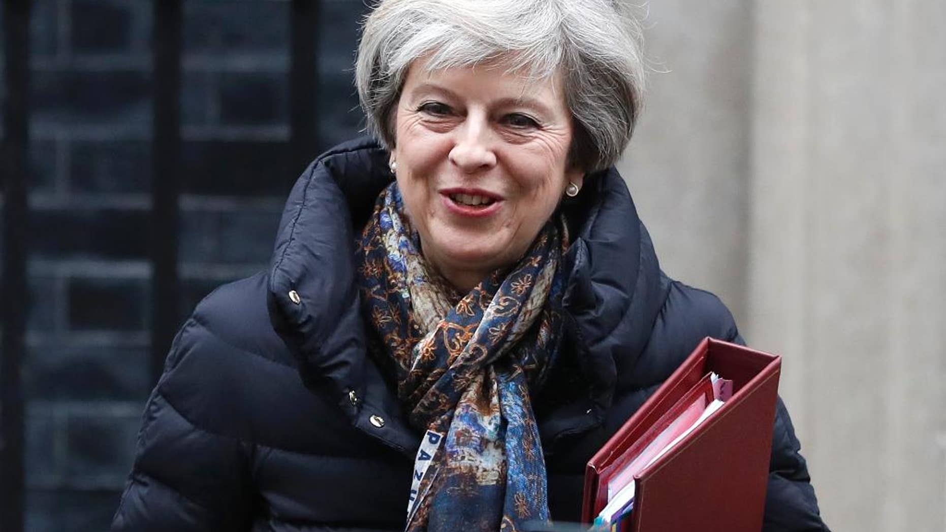 Britain's Prime Minister Theresa May leaves 10 Downing Street to attend parliament in London, Wednesday, Jan. 25, 2017. (AP Photo/Kirsty Wigglesworth)
