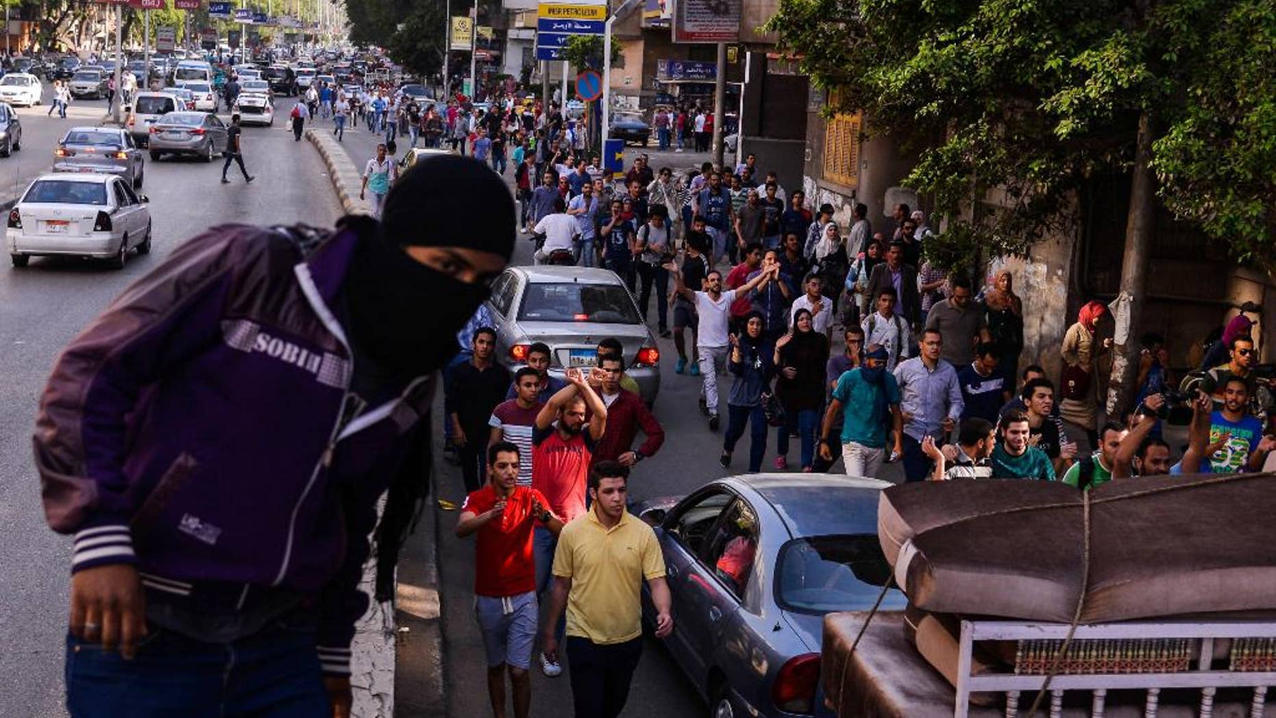 Egyptians demonstrate against President Abdel-Fattah el-Sissi in Mesaha square in Cairo's Dokki district, Monday, April 25, 2016. Police fired tear gas and birdshot on Monday to disperse hundreds of demonstrators calling on el-Sissi to step down over his government's decision to surrender control over two strategic Red Sea islands to Saudi Arabia. (AP Photo/Mostafa Darwish)