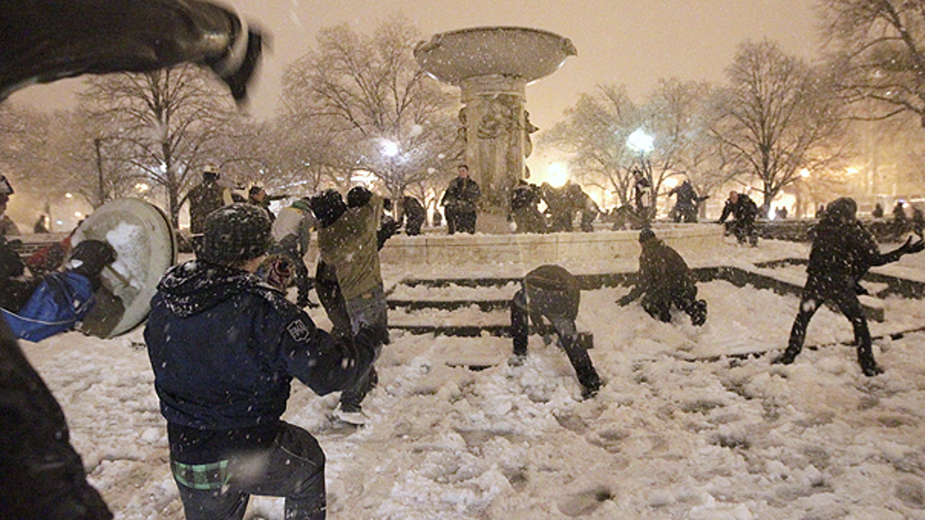 Jan. 26: A snowball fight breaks out at Dupont Circle in Washington in the still-falling snow.
