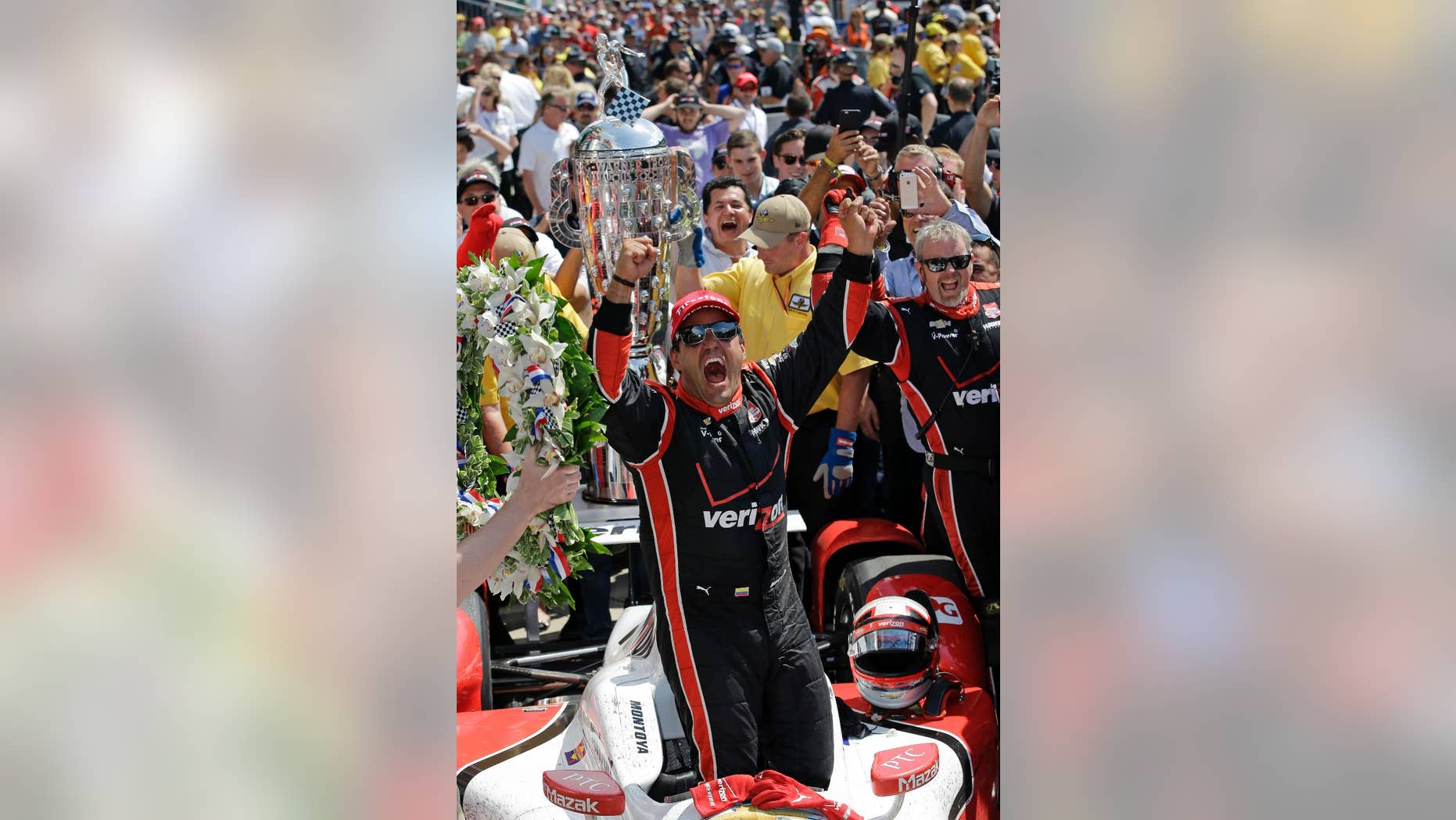 FILE - In this May 24, 2015, file photo, Juan Pablo Montoya, of Colombia, celebrates after winning the 99th running of the Indianapolis 500 auto race at Indianapolis Motor Speedway in Indianapolis. (AP Photo/Darron Cummings, File)