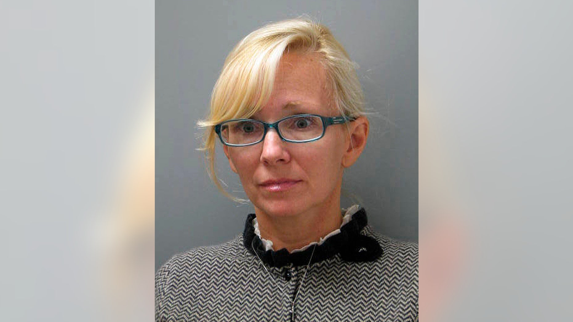FILE - In this undated file photo provided Wednesday, Nov. 5, 2014 by the Delaware State Police, Molly Shattuck, of Baltimore, poses for a police mug shot. The former Baltimore Ravens cheerleader charged with raping a teenage boy and providing other minors with alcohol is set for a court hearing Wednesday Jan. 7, 2015. (AP Photo/Delaware State Police, File)
