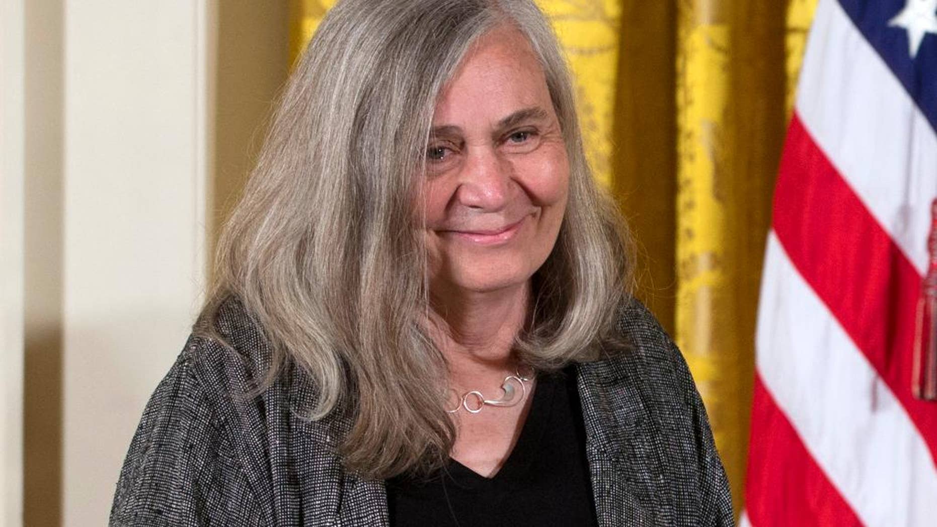 FILE - In this July 10, 2013, file photo, Marilynne Robinson appears at a ceremony awarding her the 2012 National Humanities Medal for grace and intelligence in writing in the East Room of White House in Washington. Robinson, the acclaimed author of such novels as “Gilead” and “Housekeeping,” is this year’s winner of the Library of Congress Prize for American Fiction, a lifetime achievement honor. (AP Photo/Carolyn Kaster, File)