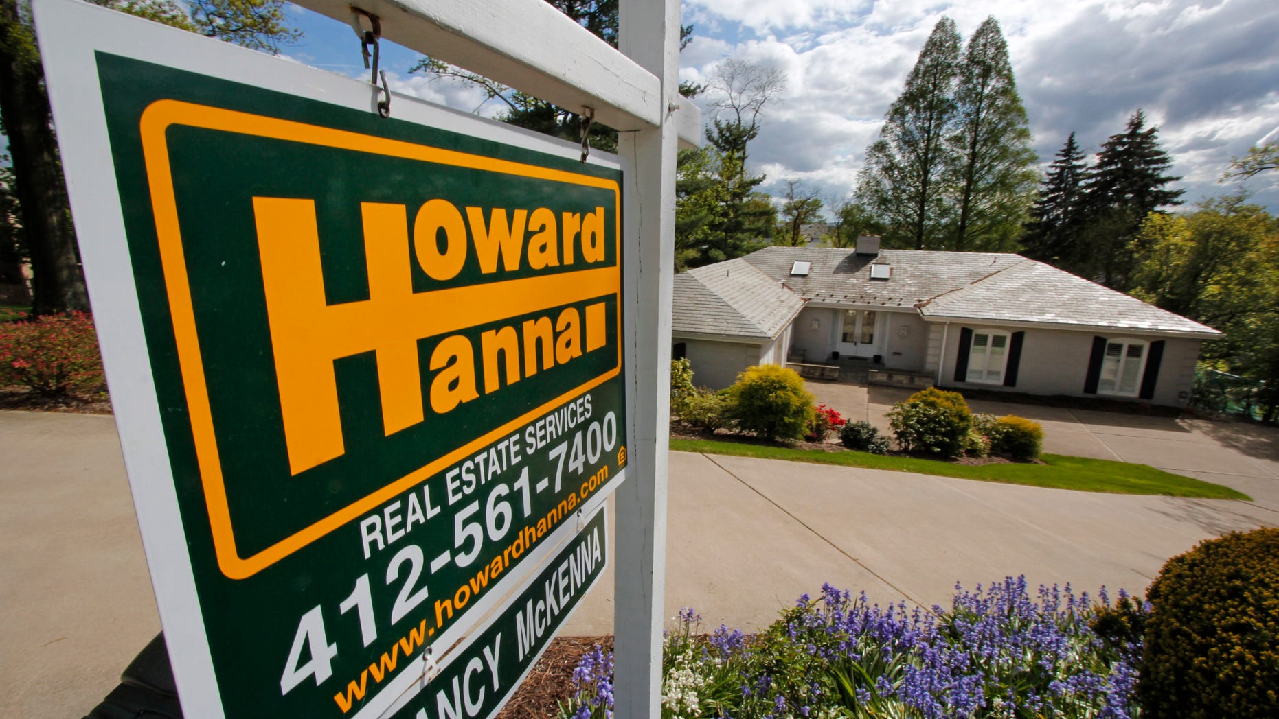 In this Monday, May 6, 2013, photo, a home is for sale in Mt. Lebanon, Pa. Freddie Mac reports on mortgage rates for this week on Thursday, May 16, 2013. T (AP Photo/Gene J. Puskar)
