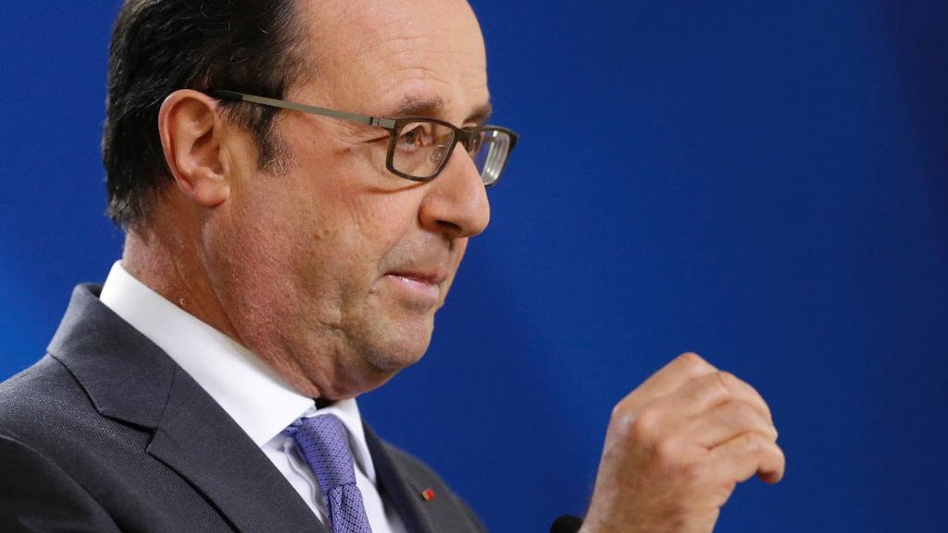 French President Francois Hollande answers a question from the media during the final press briefing at the EU Summit in Brussels, Friday, Oct. 21, 2016. France warned British Prime Minister Theresa May at her maiden European Union summit that she would face a tough, unyielding bloc if she sought too many concessions during the negotiations to leave the 28-nation EU. (AP Photo/Alastair Grant)