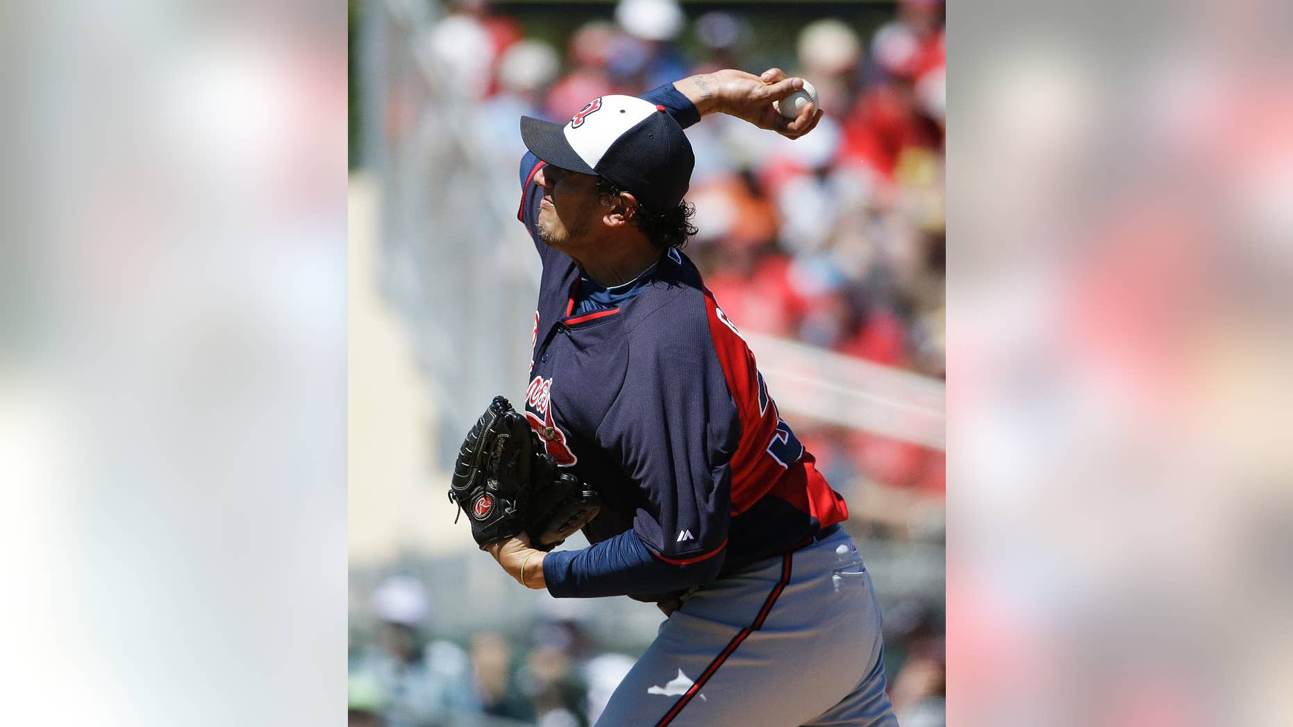 FILE - IN this March 13, 2014 file photo, Atlanta Braves starting pitcher Freddy Garcia plays in an exhibition spring training baseball game against the St. Louis Cardinals in Jupiter, Fla. Former All-Star pitcher Garcia has joined Taiwan's EDA Rhinos and is set to become the highest-paid player in the local league's history.(AP Photo/David Goldman, File)