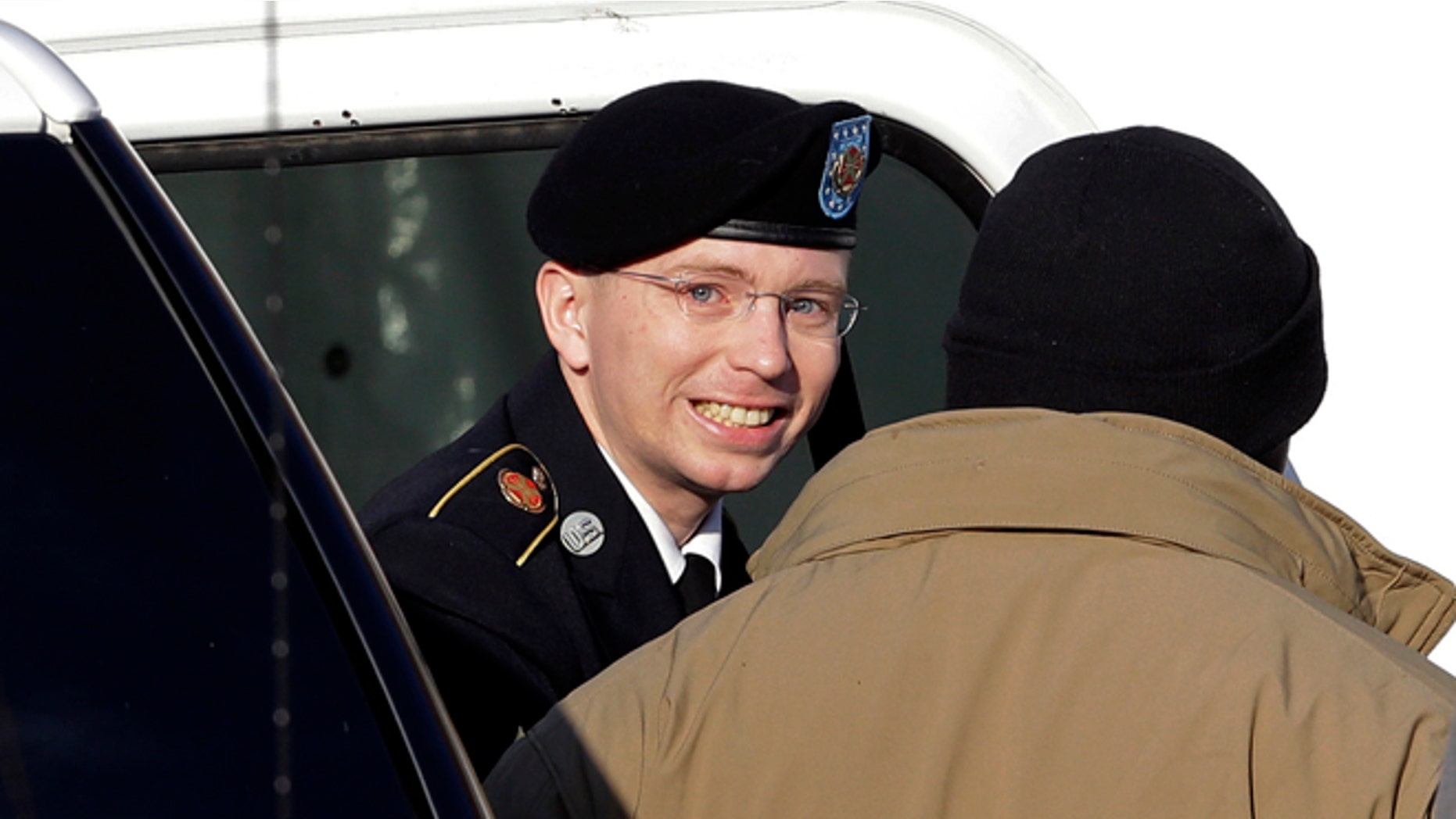 Nov. 28: Army Pfc. Bradley Manning, center, steps out of a security vehicle as he is escorted into a courthouse in Fort Meade, Md.
