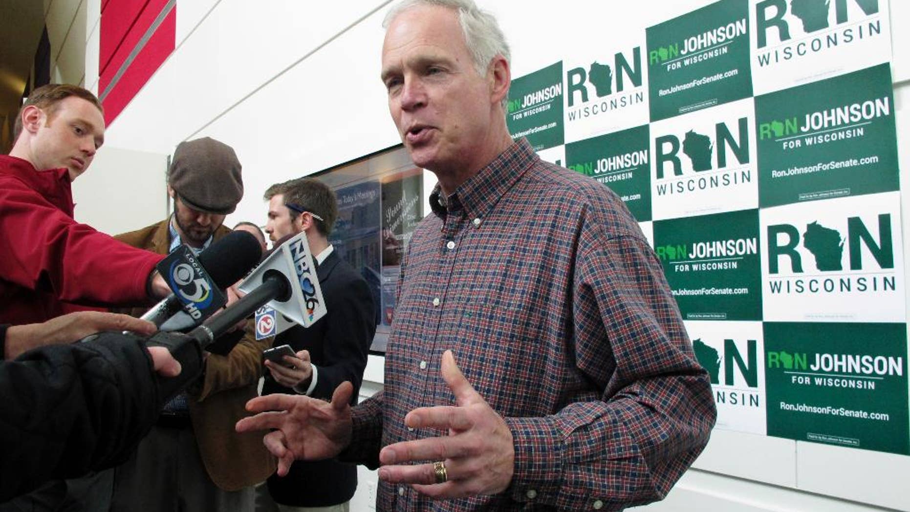 U.S. Sen. Ron Johnson, R-Wis., speaks with reporters Friday, May 13, 2016, in Green Bay, Wis., ahead of the Wisconsin Republican Party convention. Johnson says he is sympathetic with Donald Trump as the presumptive Republican presidential nominee tries to get smart on policy and win over fellow Republicans. (AP Photo/Scott Bauer)