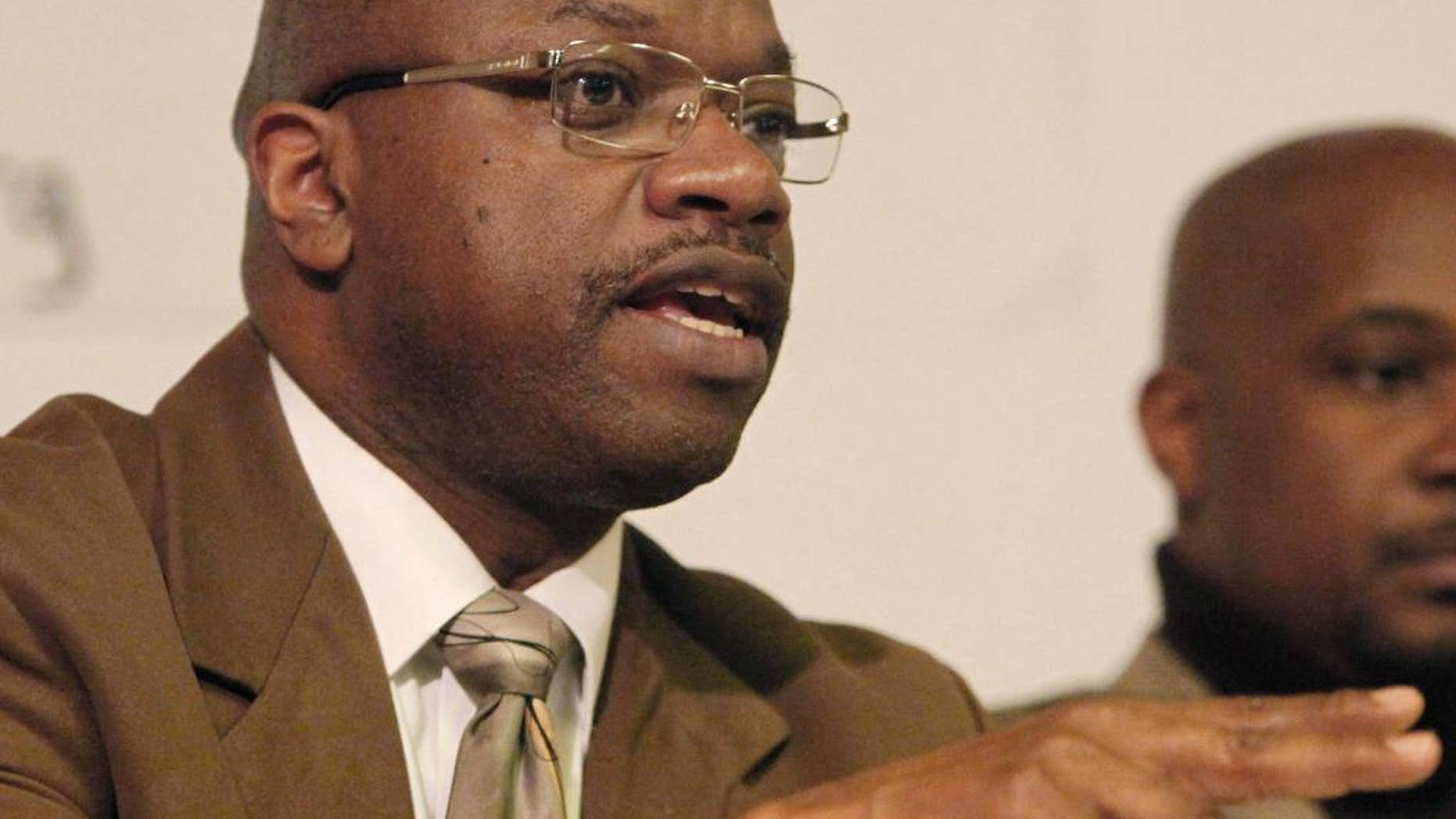 FILE - In this Feb. 10, 2011 file photo, Chicago Alderman Willie Cochran, left, address the residents of the 20th Ward in Chicago. Cochran, a prominent Chicago alderman indicted on federal corruption charges, is due for his first court appearance. Cochran has been charged in a 15-count indictment, including allegations that he extorted money from a liquor store owner and pilfered funds from a local government activities fund to pay for gambling and his daughter's college tuition. His arraignment in federal court is Friday, Dec. 24, 2016, morning. (AP Photo/Charles Rex Arbogast, File)