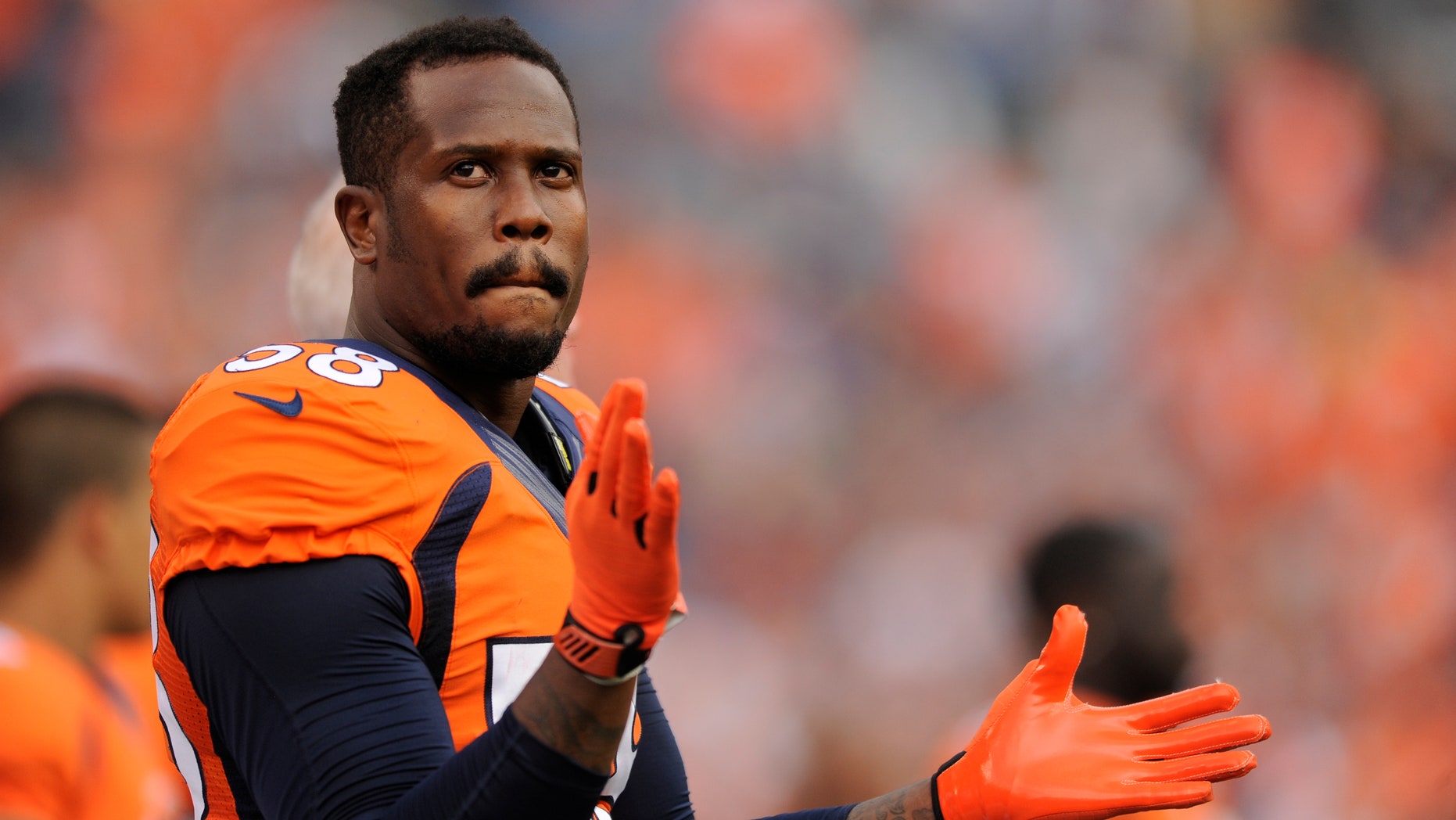 File-This file photo of Aug. 24, 2013 shows Denver Broncos outside linebacker Von Miller looking on during an NFL pre-season football game against the St. Louis Rams in Denver. After six weeks on the sideline, Miller returns to the Denver Broncos on Monday Oct. 14, 2013. They can use him. Ranked last in pass defense, the Broncos gave up another 303 yards to Jacksonville and their next game is against Andrew Luck and the Colts. (AP Photo/Jack Dempsey, File)