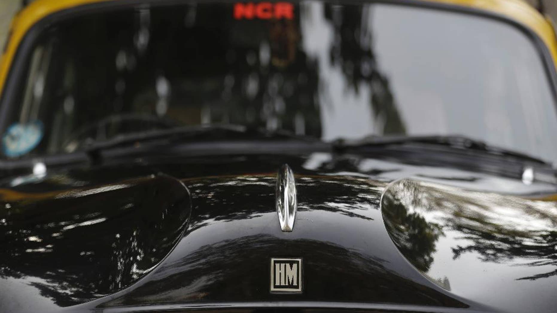Close up Hindustan Ambassadors taxi in New Delhi, India, Monday, Feb. 13, 2017. Over the weekend, the C.K. Birla Group that owns Hindustan Motors said it had signed an agreement with Peugeot SA to sell the Ambassador for 800 million rupees ($12 million). (AP Photo/Tsering Topgyal)