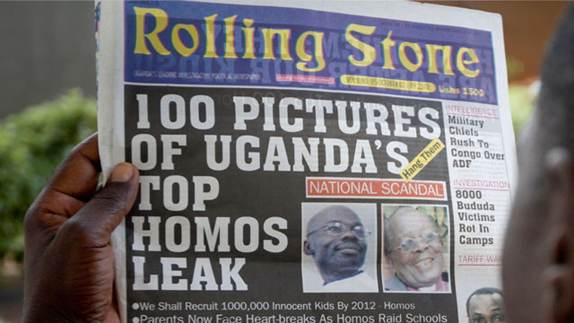 A Ugandan man reads the headline of the Ugandan newspaper "Rolling Stone" in Kampala, Uganda. Tuesday, Oct. 19, 2010, in which the papers reveals the identity of allegedly gay members of Ugandan society and calls for public punishment against those individuals.