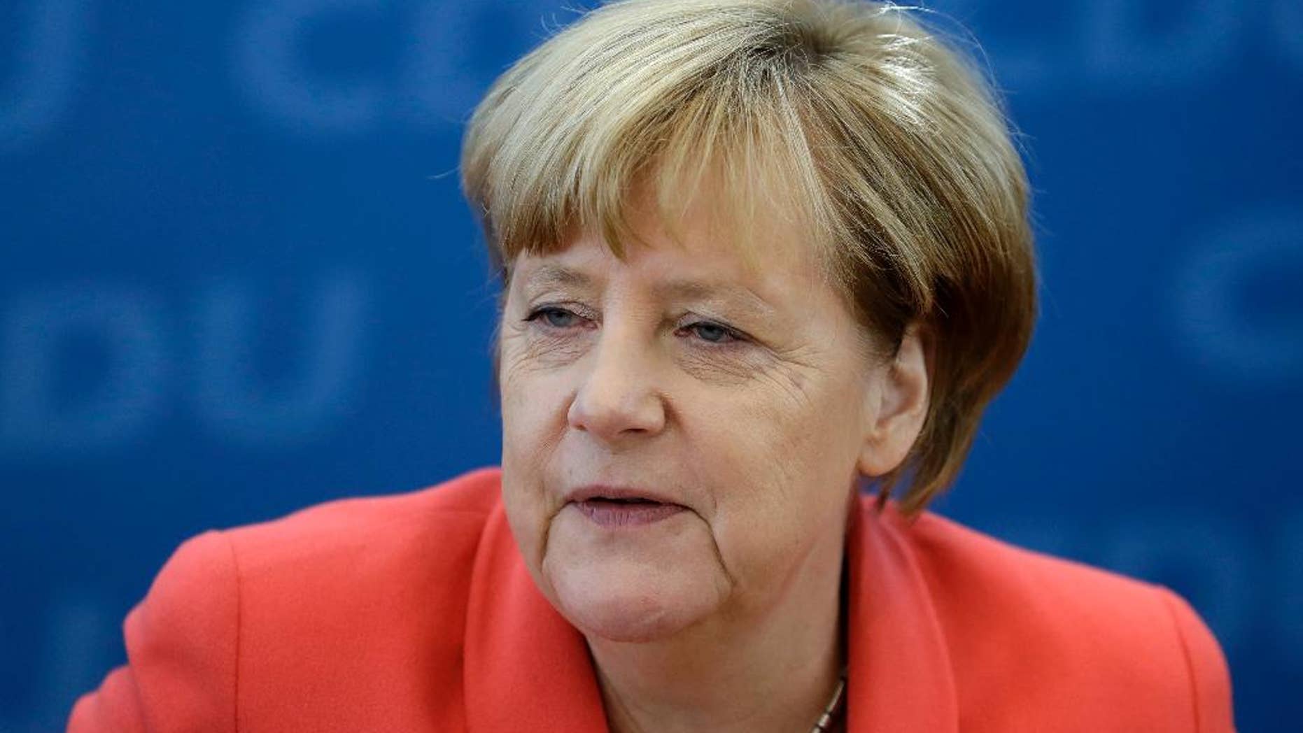 German Chancellor Angela Merkel waits for the beginning of a board meeting of the Christian Democratic party CDU in Berlin, Germany, Monday, Sept. 19, 2016, the day after Merkel's party endured a second setback in a state election in two weeks, as many voters turned to the left and right in Berlin. (AP Photo/Michael Sohn)