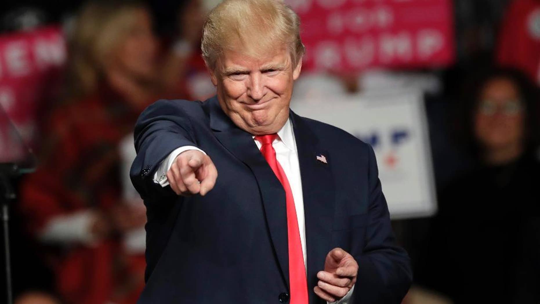 FILE- In this Oct. 31, 2016 file photo, then Republican presidential candidate Donald Trump acknowledges the crowd before speaking at Macomb Community College in Warren, Mich. Northern Michigan's Lake Superior State University on Saturday, Dec. 31, 2016, released its 42nd annual List of Words Banished from the Queen's English for Misuse, Overuse and General Uselessness. "Bigly" made Merriam-Webster's Top 10 for 2016. Trump was fond this year of saying "big league" but making it sound like "bigly," an archaic adverb or adjective dating to around 1400. (AP Photo/Carlos Osorio, File)