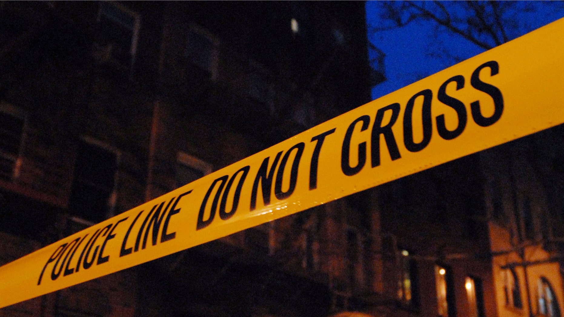NEW YORK - FEBRUARY 22: Police tape hangs outside the apartment building at 31 Downing Street, where Vado Diomande lives on the fifth floor, as police officials work at the scene February 22, 2006 in the West Village neighborhood of New York City. Diomande, a drum maker, is being treated at a hospital for a case of inhaled anthrax. (Photo by Jonathan Fickies/Getty Images)