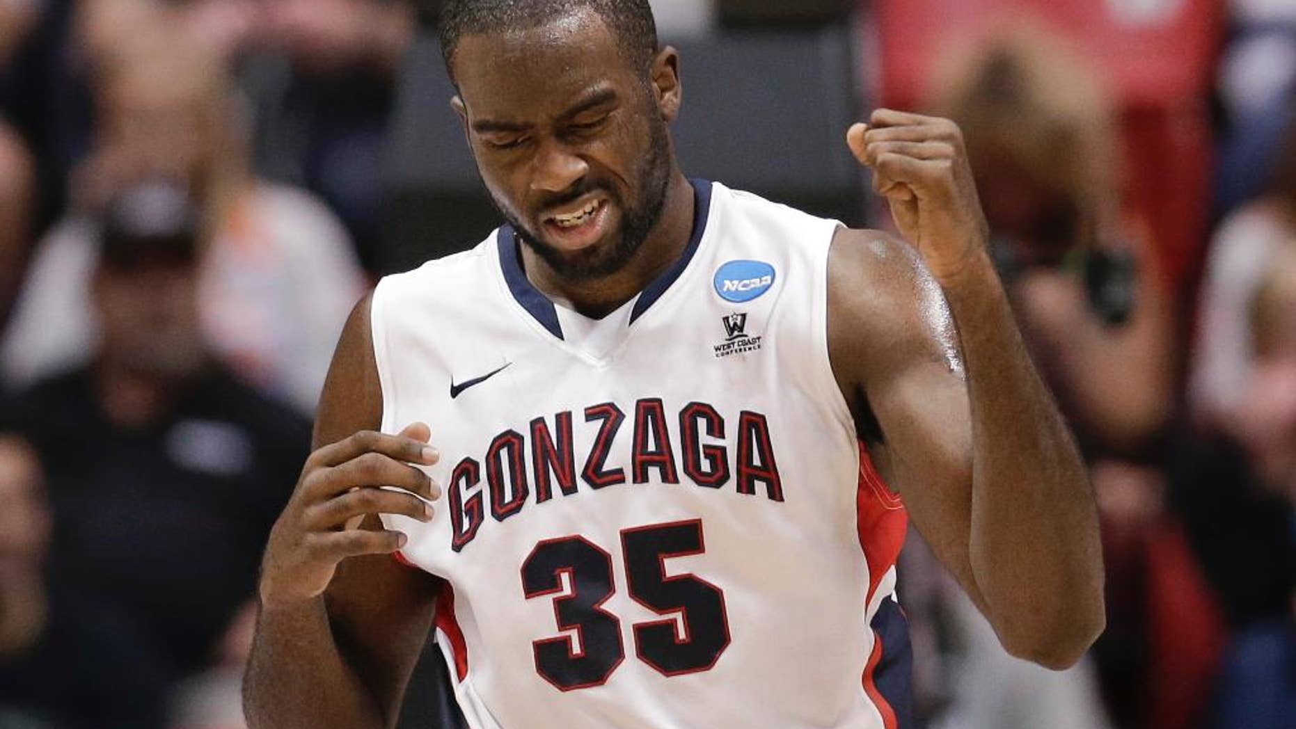 Gonzaga's Sam Dower pumps his fist after scoring during the second half of Gonzaga's 85-77 victory over Oklahoma State in a second-round game in the NCAA men's college basketball tournament Friday, March 21, 2014, in San Diego. (AP Photo/Gregory Bull)