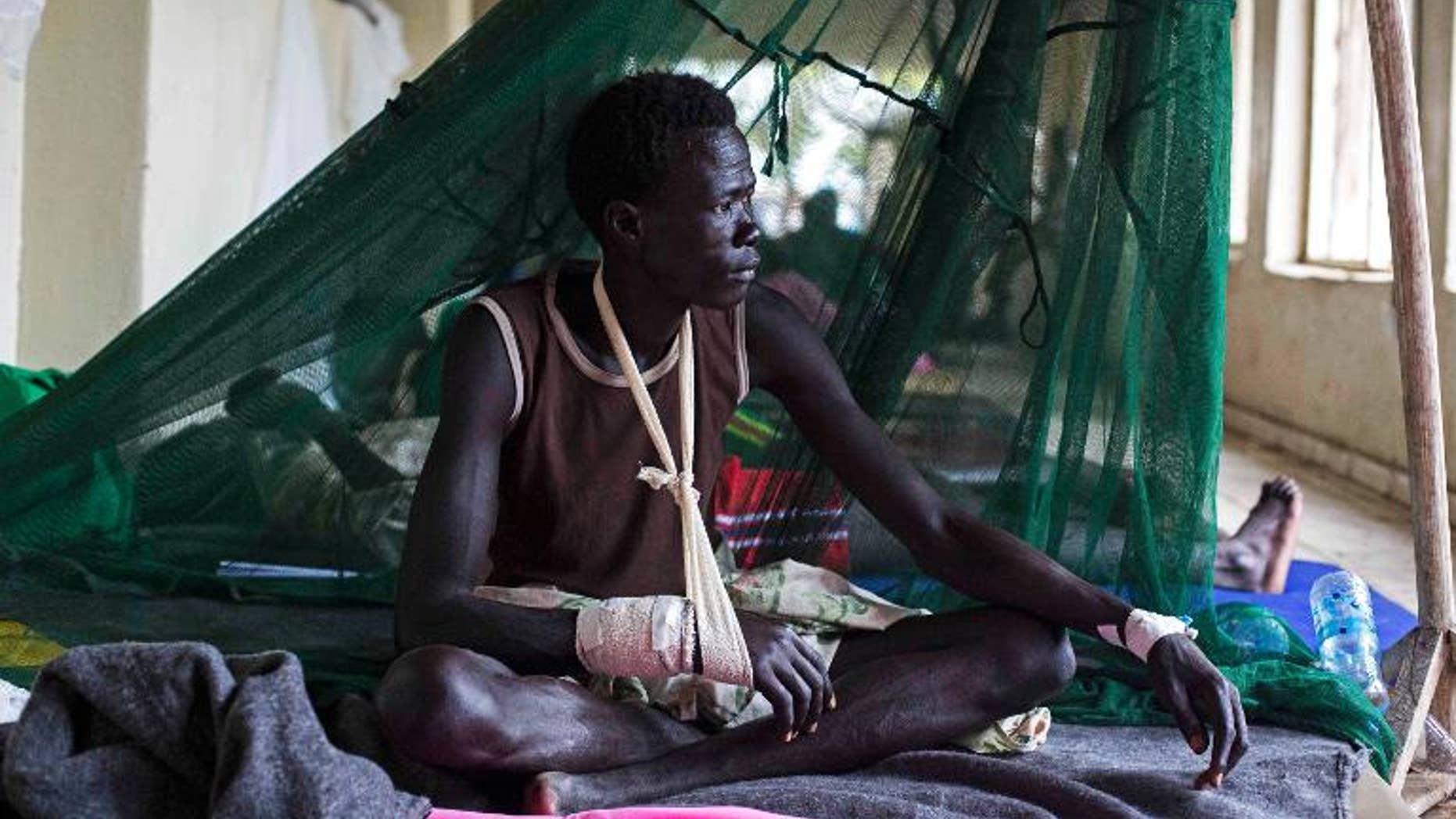 A man injured during tribal clashes sits in a hospital in Bor, South Sudan on July 15.