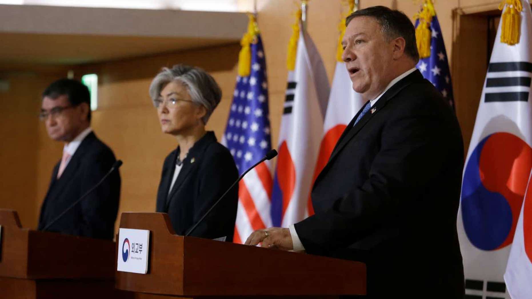 U.S. Secretary of State Mike Pompeo, right, speaks as South Korean Foreign Minister Kang Kyung-wha, center, and Japanese Foreign Minister Taro Kono listen during a joint news conference in Seoul, June 14, 2018.