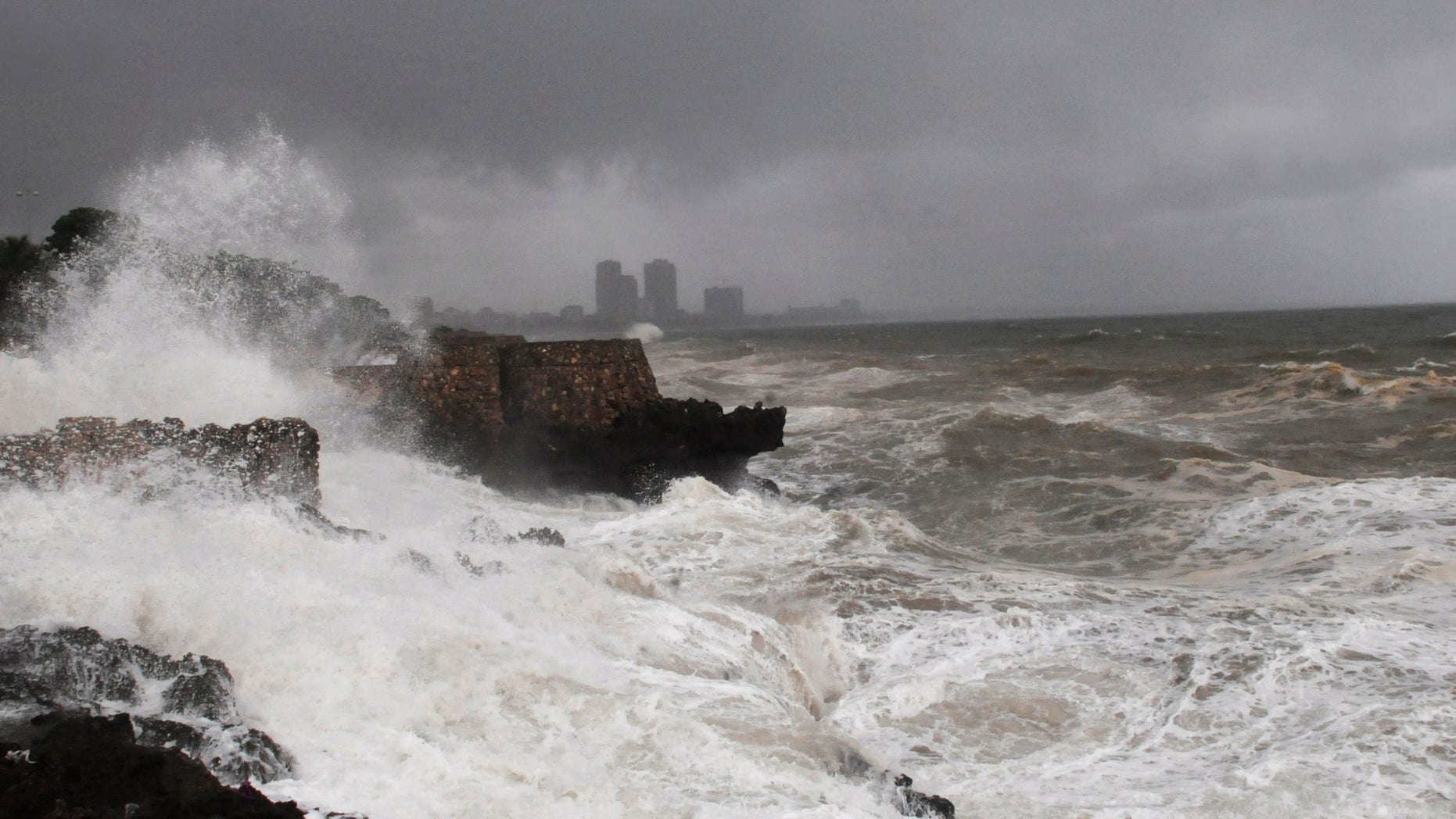 High waves crash into the Santo Domingo waterfront as Tropical Storm Emily approaches the shores of the Dominican Republic. Forecasters say Emily will drop a huge amount of rain on the Dominican Republic and Haiti.