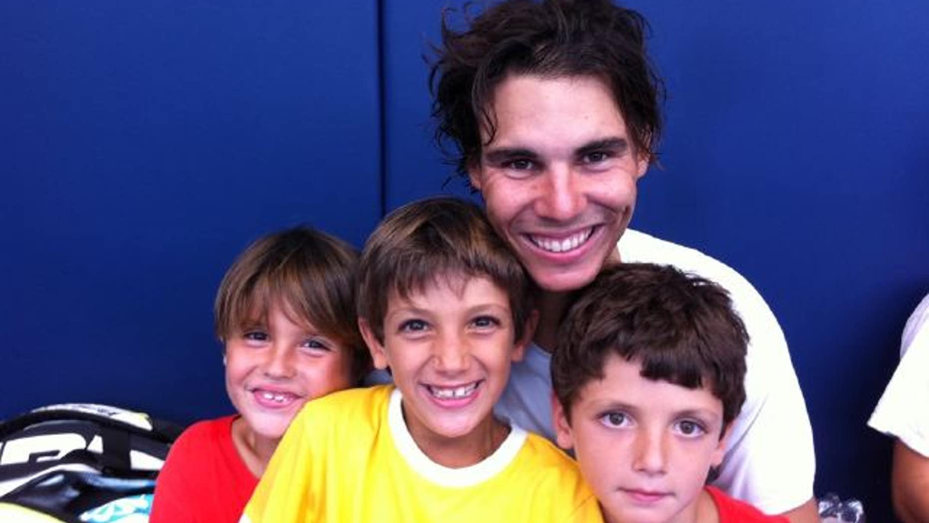 Aug 2: Rafael Nadal posted this photo of him and his three little cousins at his training center.