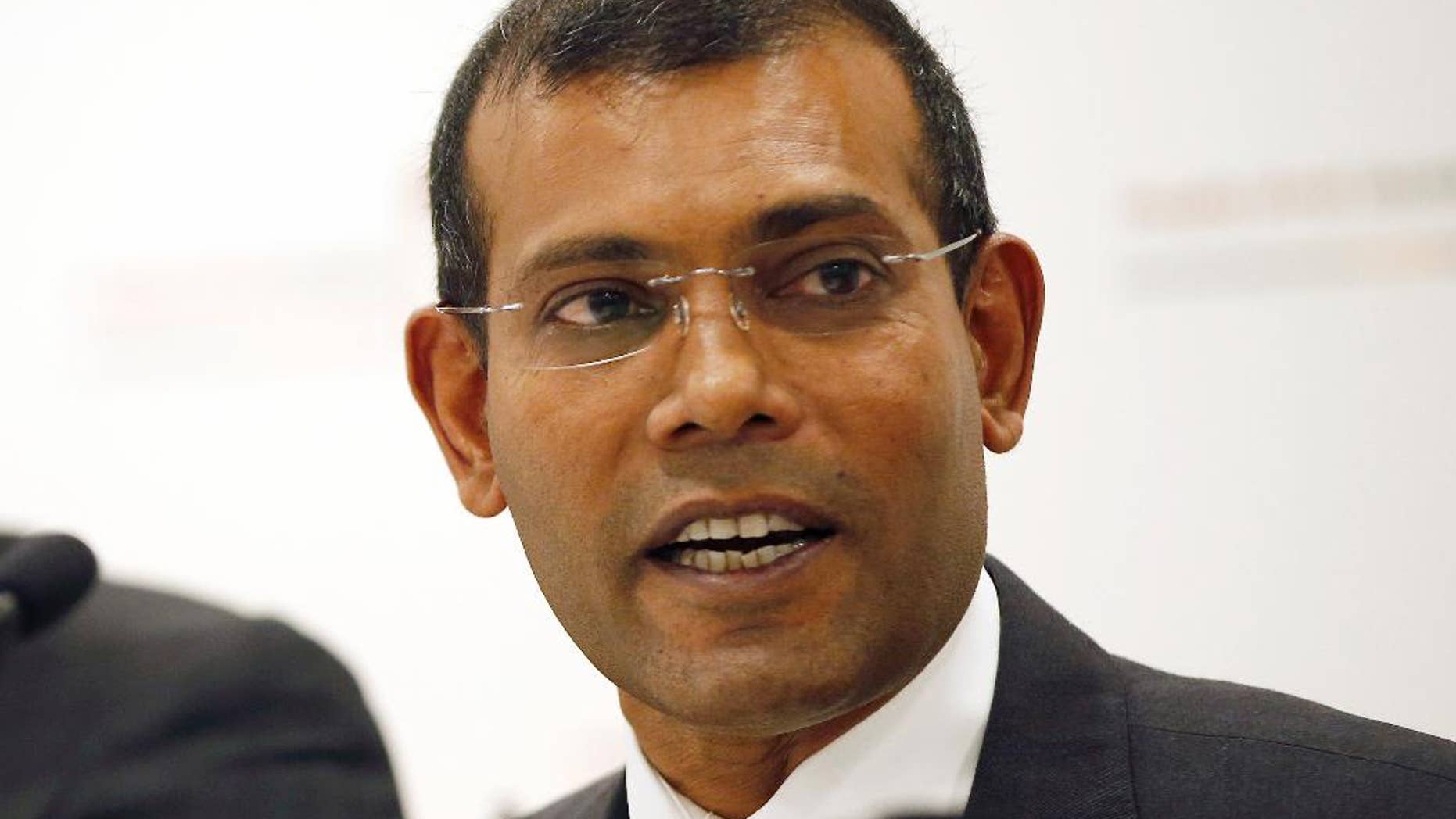 FILE - In this Monday, Jan. 25, 2016, file photo, former Maldives president Mohamed Nasheed speaks during a press conference in London. Nasheed, the first democratically elected president of the Maldives, said Tuesday from exile in Britain that he has an agreement with the country's former strongman Maumoon Abdul Gayoom to counter the current president President Yameen Abdul Gayoom, who is increasing his stranglehold on power. (AP Photo/Alastair Grant, File)