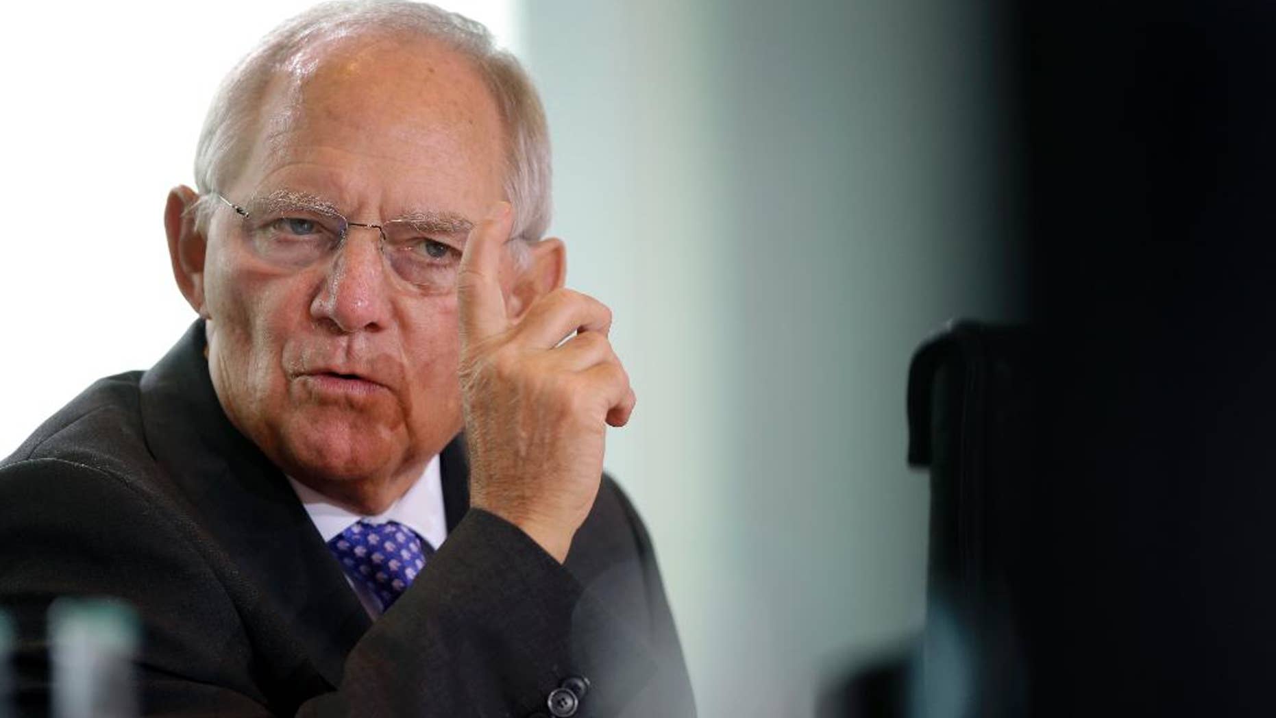 FILE - In this Nov. 5, 2014 file picture German Finance Minister Wolfgang Schaeuble gestures during a cabinet meeting in Berlin. s German Finance Minister Wolfgang Schaeuble on Sunday March 1, 2015 told German newspaper Bild am Sonntag he trusts Greece’s current government to fulfill the conditions for the bailout deal, but also made clear the country would not receive any further money if it didn’t. (AP Photo/Michael Sohn,file)