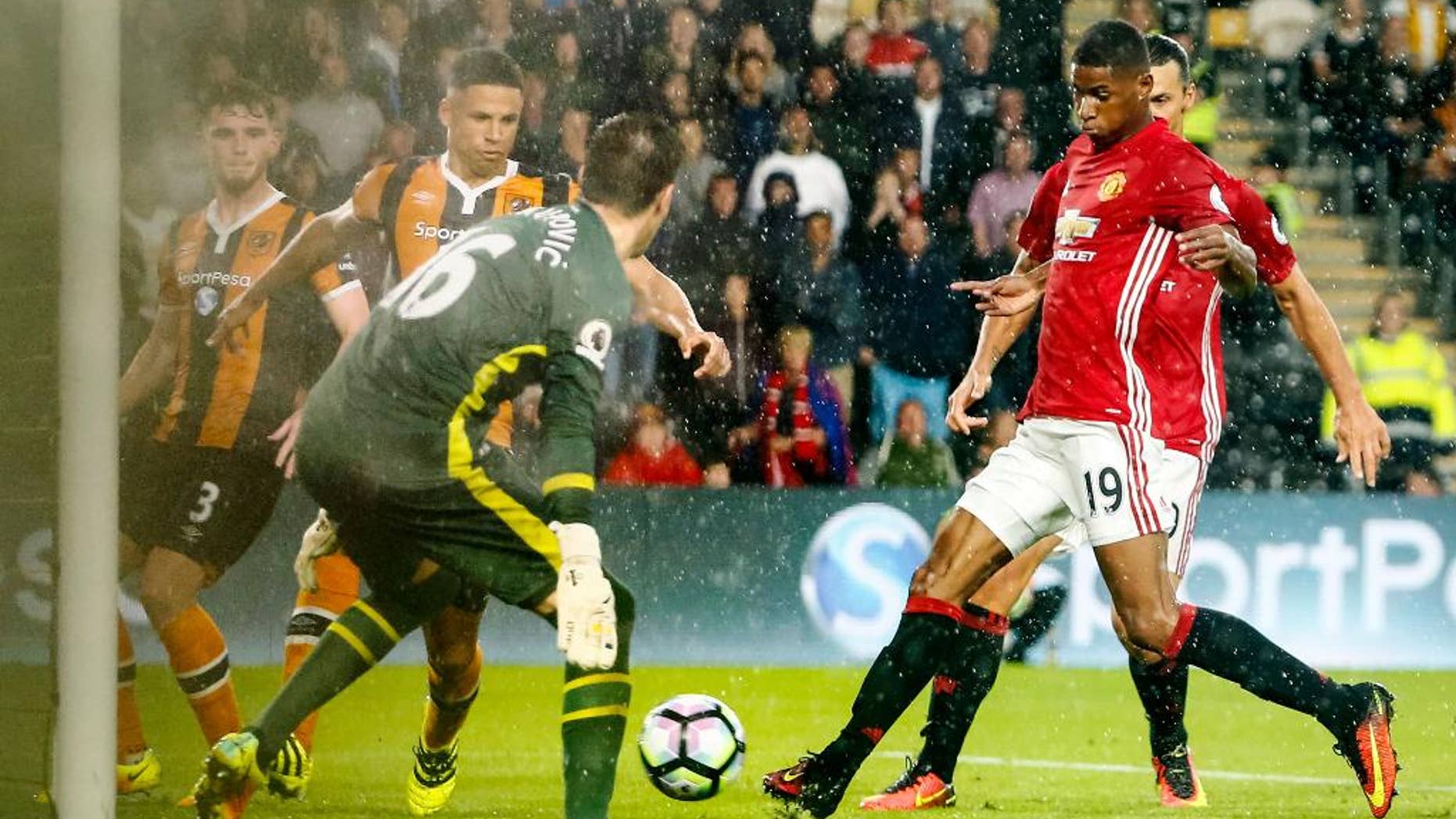 Manchester United's Marcus Rashford, right, scores the only goal of the game during the Premier League soccer match Hull City versus Manchester United at the KCOM Stadium, Hull, England, Saturday Aug, 27, 2016. (Danny Lawson/PA via AP)