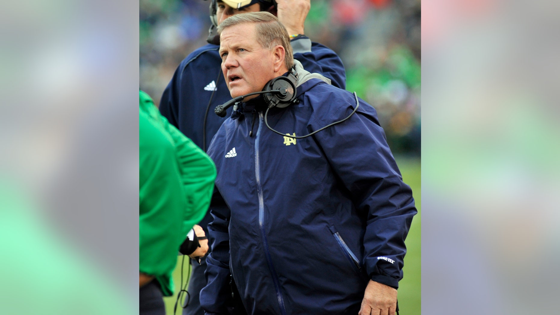 Notre Dame coach Brian Kelly talks to the officials in the first half of an NCAA college football game against Navy, Saturday, Nov. 2, 2013, in South Bend, Ind. (AP Photo/Joe Raymond)