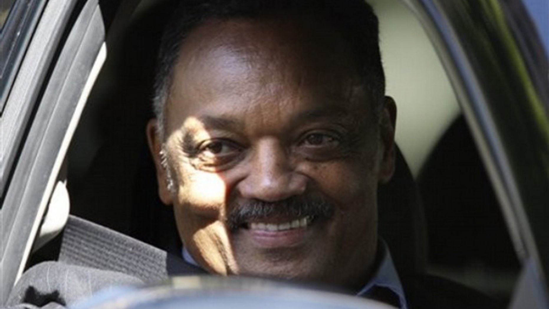 Rev. Jesse Jackson smiles at fans as he departs the Beverly Wilshire Hotel, Tuesday, July 7, 2009 in Beverly Hills after attending the Michael Jackson memorial in Los Angeles at the Staples Center. (AP Photo/Carolyn Kaster)