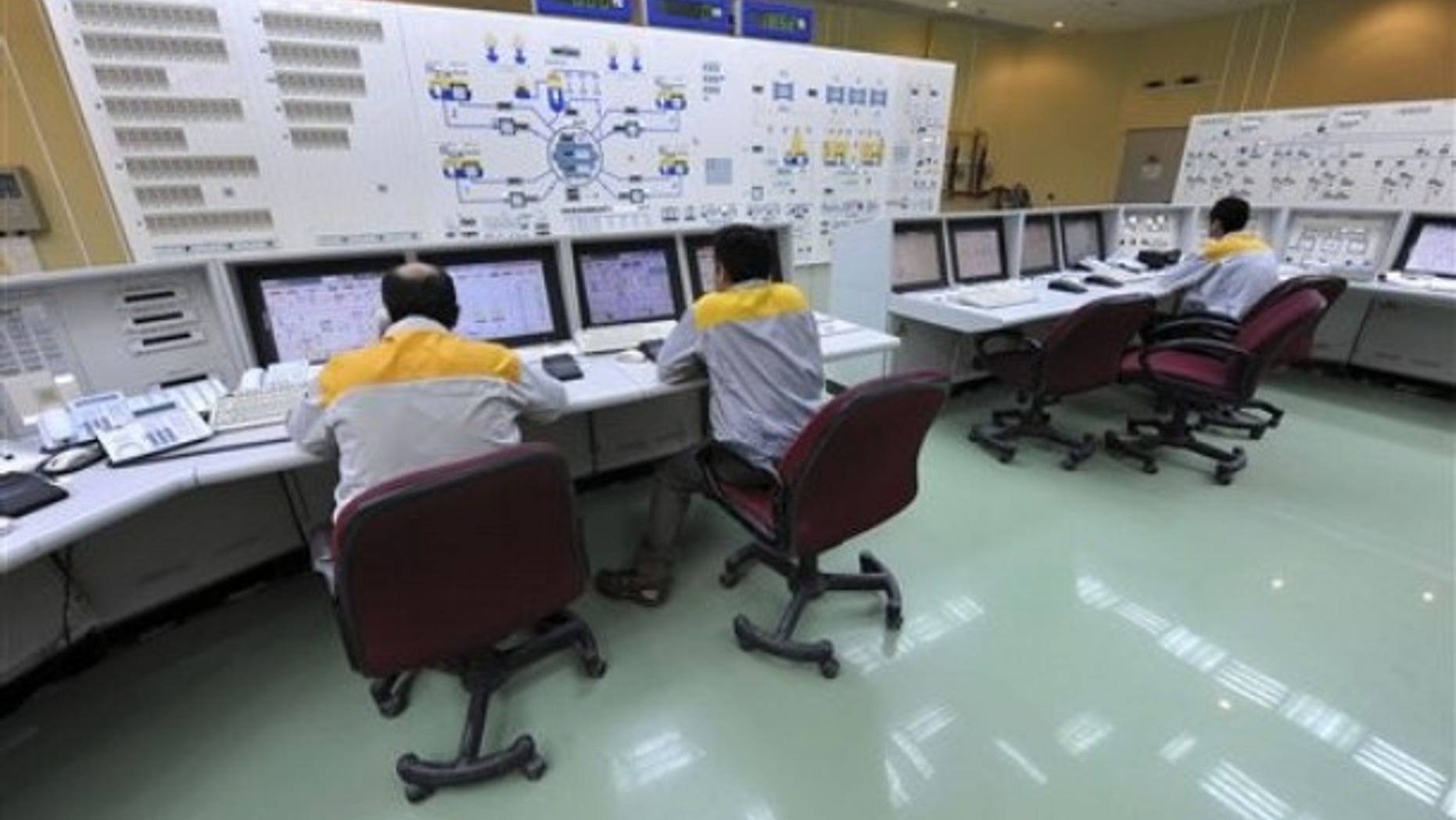 Iranian technicians work at the Bushehr nuclear power plant, outside the southern city of Bushehr, Iran.