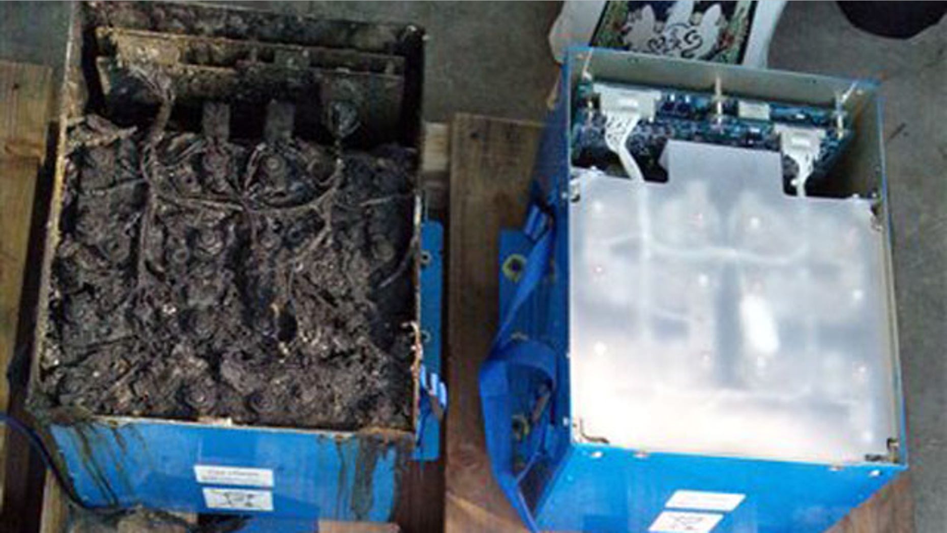 Jan. 17, 2013: The distorted main lithium-ion battery and its lid, left, of the All Nippon Airways' Boeing 787 which made an emergency landing.