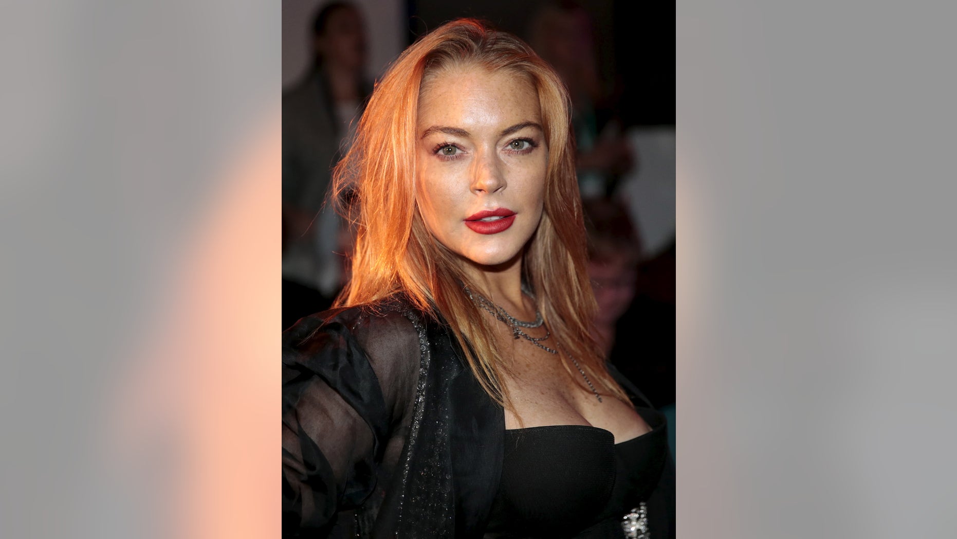 Actress Lindsay Lohan arrives for the presentation of the Gareth Pugh Spring/Summer 2016 collection during London Fashion Week in London, Britain September 19, 2015.