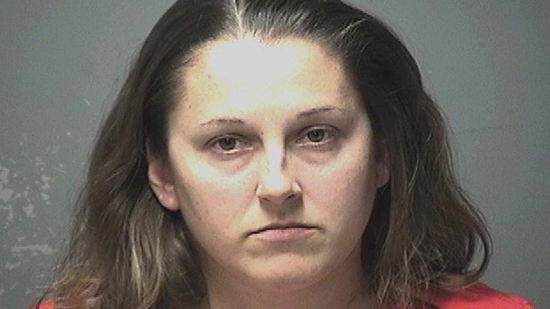 This booking photograph released by the Manchester Police Department shows Chelsea Blais, arrested Tuesday, March 21, 2017, and charged with four counts of misdemeanor simple assault of infants she was tending in a daycare center in Manchester, N.H. (Manchester Police Department via AP)