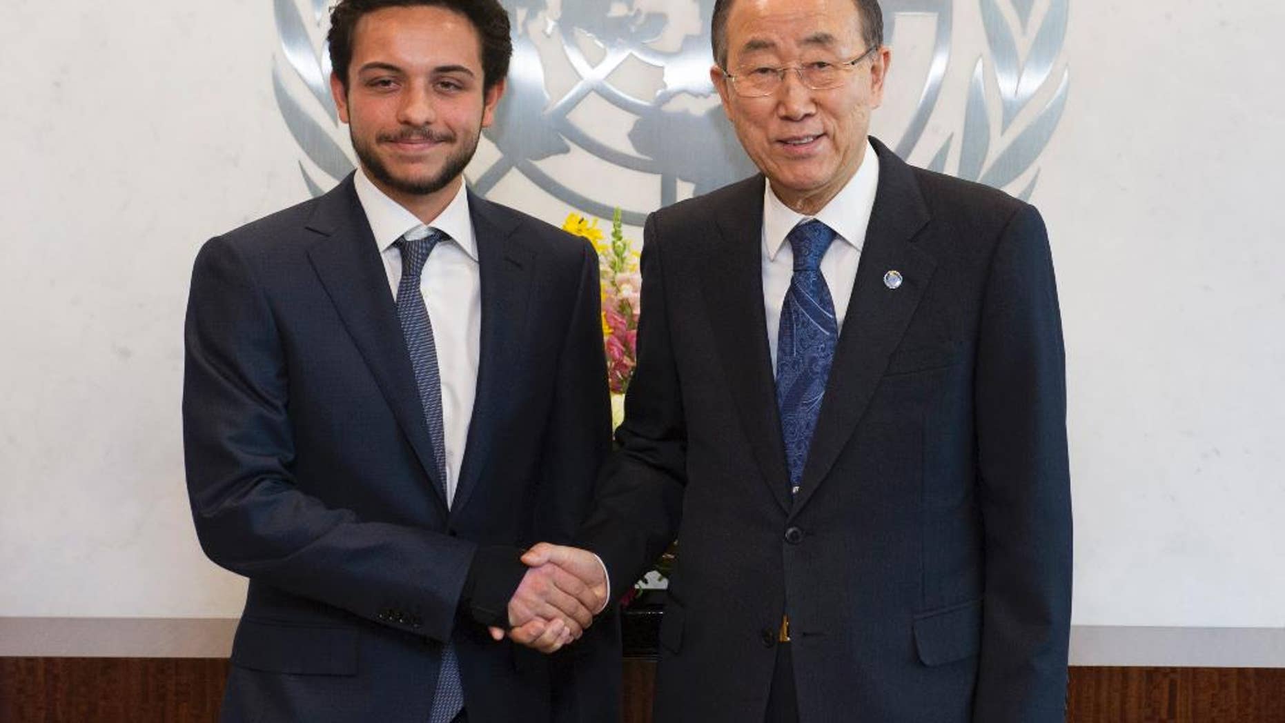 In this photo provided by the United Nations, Crown Prince Al Hussein Bin Abdullah II, Hashemite Kingdom of Jordan, left, shakes hands with United Nations Secretary General Ban Ki-moon at United Nations headquarters, Thursday, April 23, 2015. On Thursday, Jordan's 20-year-old crown prince became the youngest person ever to chair a meeting of the U.N. Security Council. (Mark Garten/The United Nations via AP)