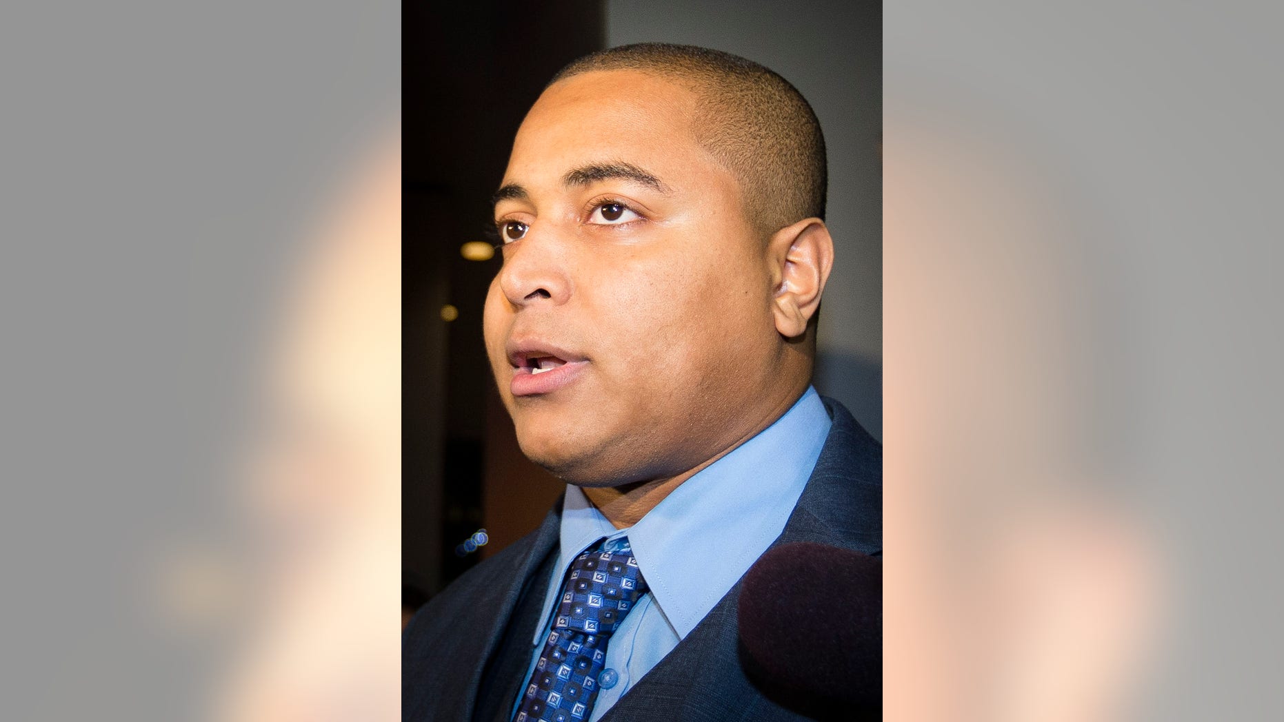 Miami Dolphins lineman Jonathan Martin speaks to members of the media outside the office of the NFL lawyer investigating the team's bullying scandal, Friday, Nov. 15, 2013, in New York. The league is trying to gather information about the harassment Martin says he was subjected to by teammate Richie Incognito. (AP Photo/John Minchillo)