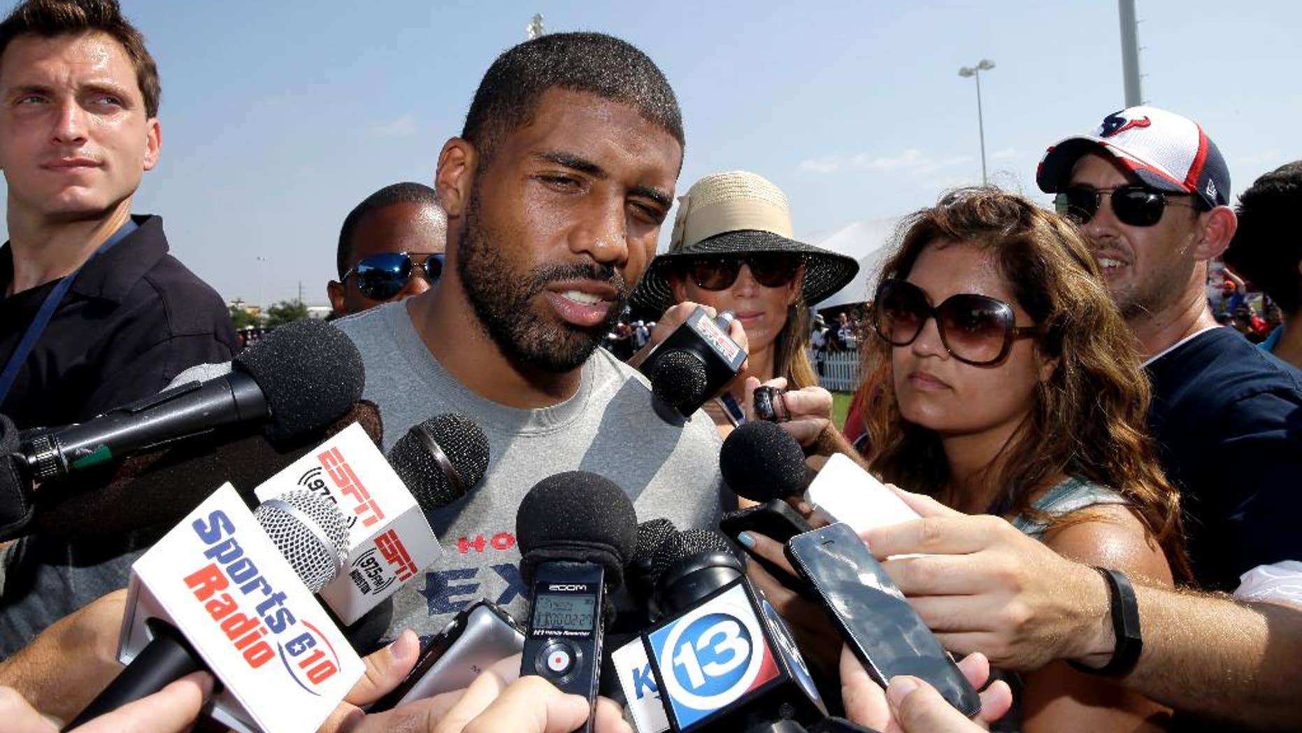 Houston Texans running back Arian Foster answers questions from reporters after an NFL football training camp practice Thursday, Aug. 14, 2014, in Houston. (AP Photo/David J. Phillip)