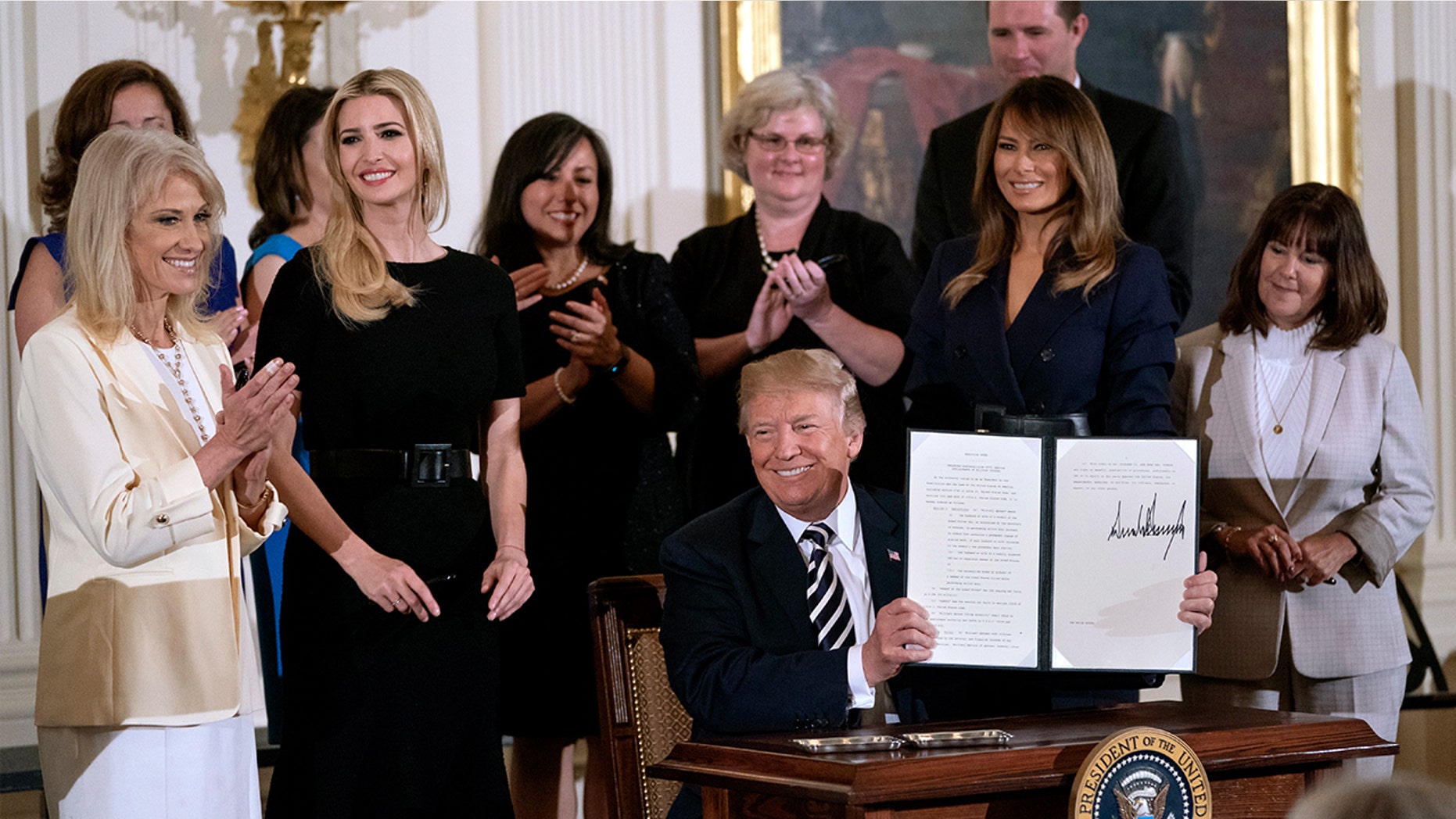First Lady Melania Trump and senior adviser Ivanka Trump sported dark, belted dresses to a May 9 engagement.