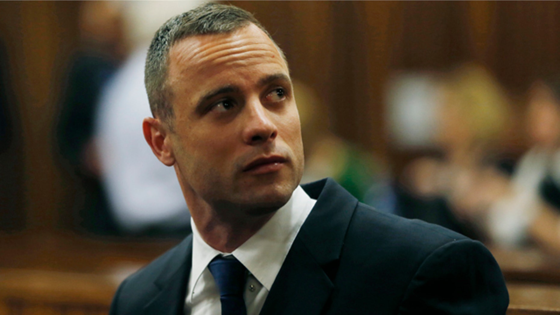 May 6, 2014: Oscar Pistorius is seated in a courtroom at the high court in Pretoria, South Africa. (AP Photo/Mike Hutchings, Pool)