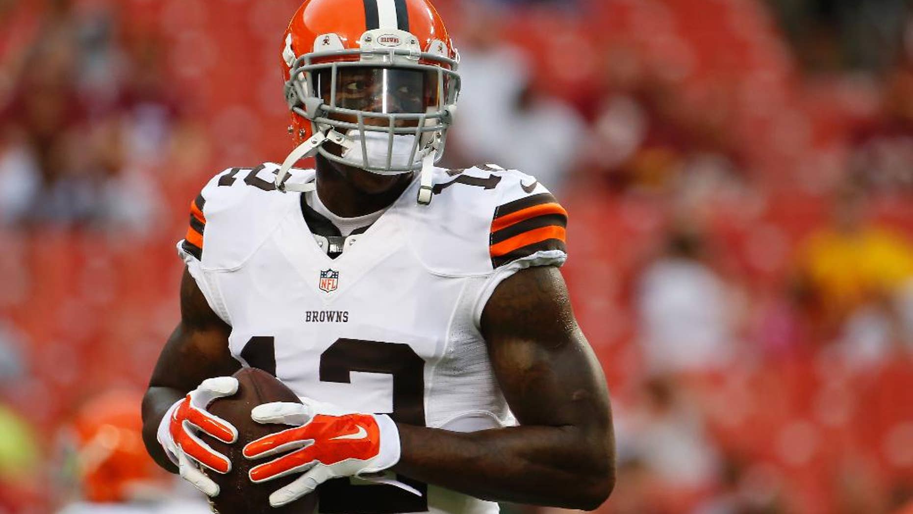 FILE - In this Aug. 18, 2014, file photo, Cleveland Browns wide receiver Josh Gordon warms up before an NFL preseason football game against the Washington Redskins in Landover, Md. Gordon's 10-game suspension for repeated violations of the NFL's drug policy is set to end Monday, Nov. 17 when the Pro Bowler will be allowed to rejoin his teammates after being exiled since September. (AP Photo/Evan Vucci, File)